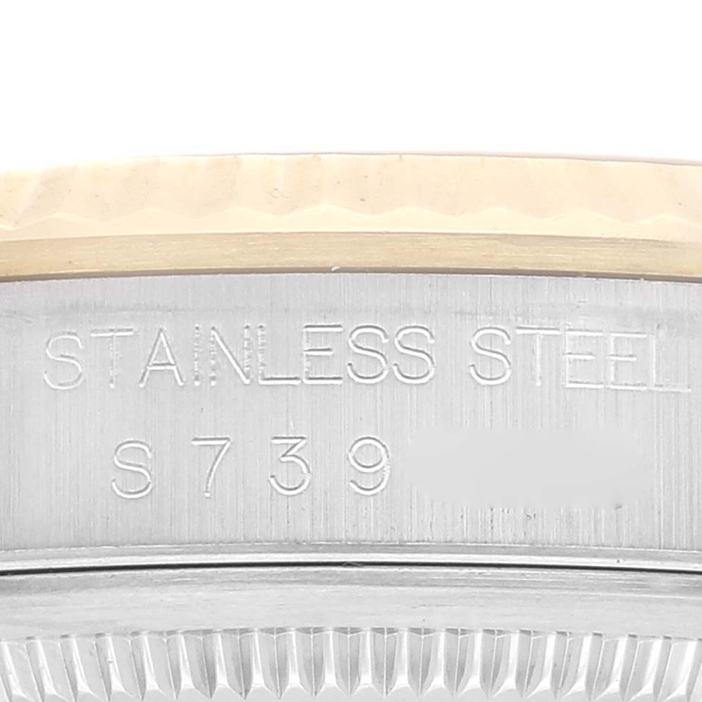 The image shows a close-up of the engraved side of the stainless steel casing of a Rolex Datejust 16233 Men's Steel and Gold (two tone) Grey Dial 16233 Men's Steel and Gold (two tone) Grey Dial watch.