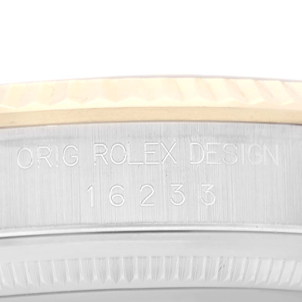 The image shows the side of the case and part of the bezel of a Rolex Datejust 16233 Men's Steel and Gold (two tone) Grey Dial 16233 Men's Steel and Gold (two tone) Grey Dial watch with model number 16233.