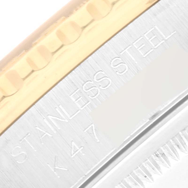 The image shows a close-up angle of the edge of a Rolex Turn-o-Graph 16263 Men's Steel and Gold (two tone) White Dial 16263 Men's Steel and Gold (two tone) White Dial watch, highlighting the stainless steel and gold bezel.
