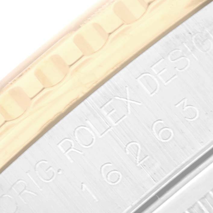 This image shows a close-up angle of the bezel and engraved edge of a Rolex Turn-o-Graph 16263 Men's Steel and Gold (two tone) White Dial 16263 Men's Steel and Gold (two tone) White Dial model.