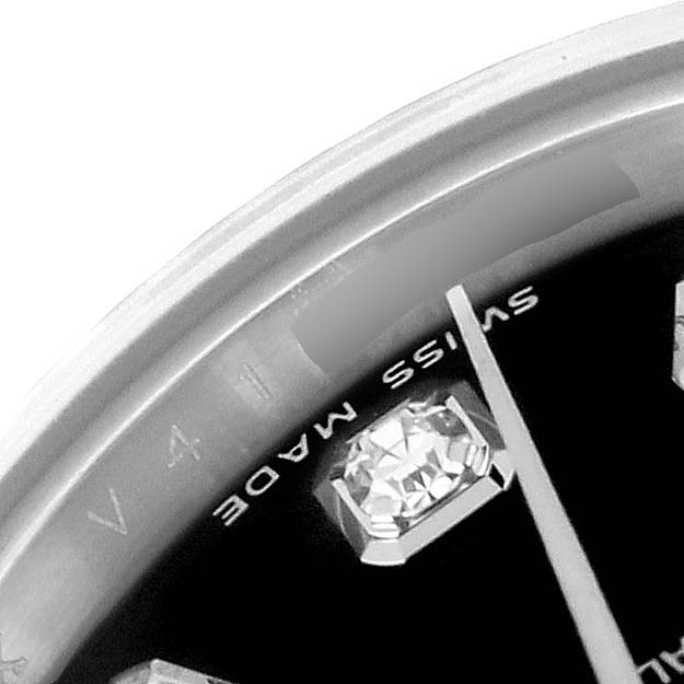The image shows a close-up of the Rolex Datejust 179174 Women's Steel and Gold (two tone) Black Dial 179174 Women's Steel and Gold (two tone) Black Dial dial, featuring the "Swiss Made" mark and a diamond hour marker.
