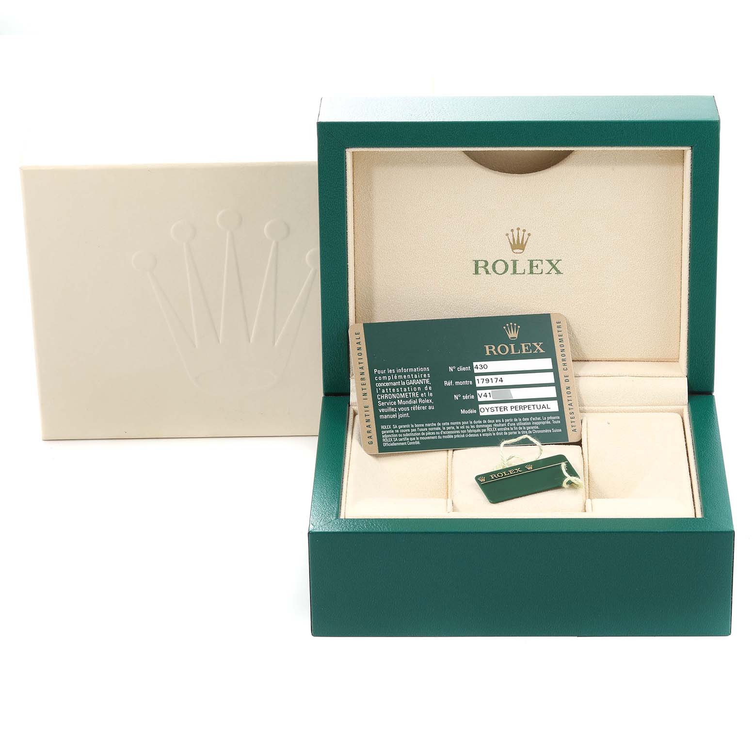 This image shows the packaging and accessories for a Rolex Datejust 179174 Women's Steel and Gold (two tone) Black Dial 179174 Women's Steel and Gold (two tone) Black Dial watch, including the box, warranty card, and hang tag.
