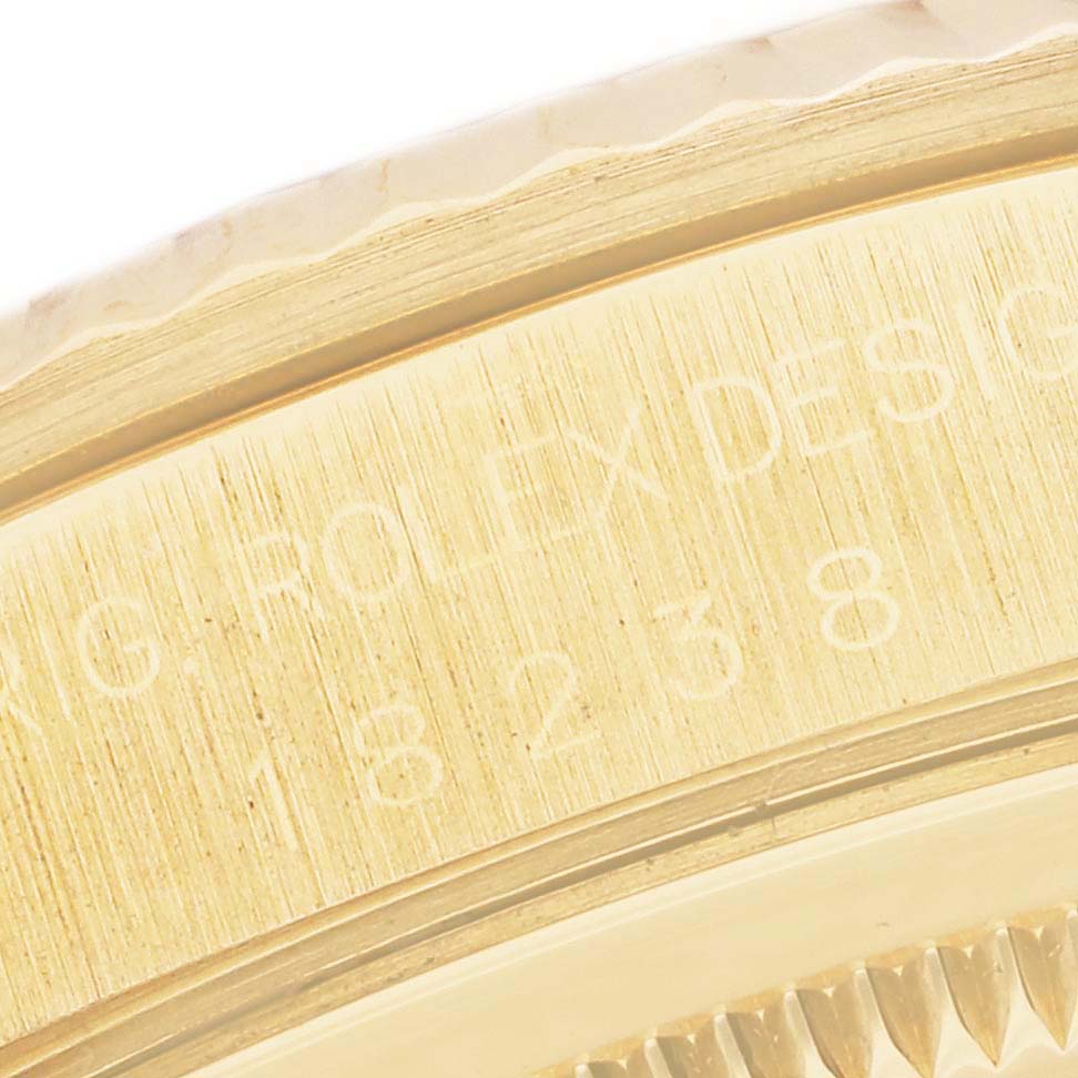This close-up image shows the engravings on the case side of a Rolex President 18238 Men
s Yellow Gold Mother of Pearl Dial 18238 Men
s Yellow Gold Mother of Pearl Dial model watch.