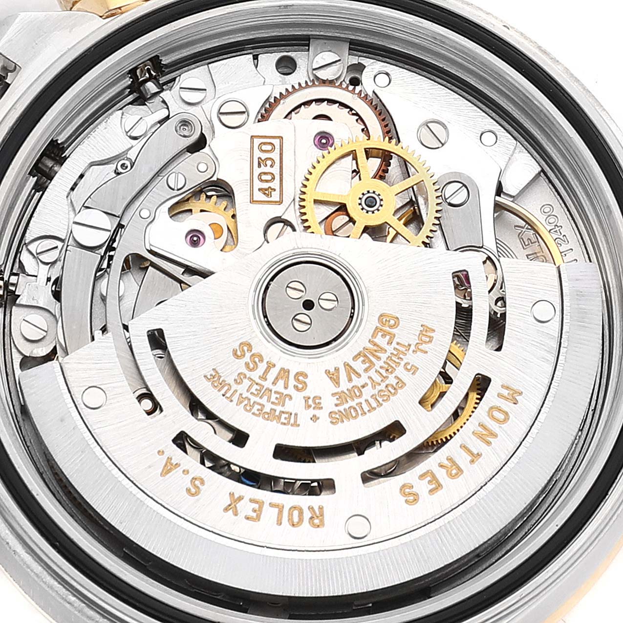 This image shows the intricate internal movement mechanism of a Rolex Daytona 16523 Men
s Steel and Gold (two tone) White Dial 16523 Men
s Steel and Gold (two tone) White Dial watch from a close-up, rear angle.