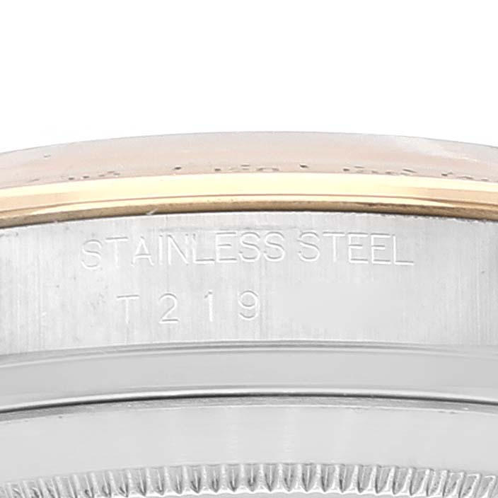 The image shows a close-up of the case side with "STAINLESS STEEL" and "T 219" engraved on a Rolex Daytona 16523 Men
s Steel and Gold (two tone) White Dial 16523 Men
s Steel and Gold (two tone) White Dial watch.