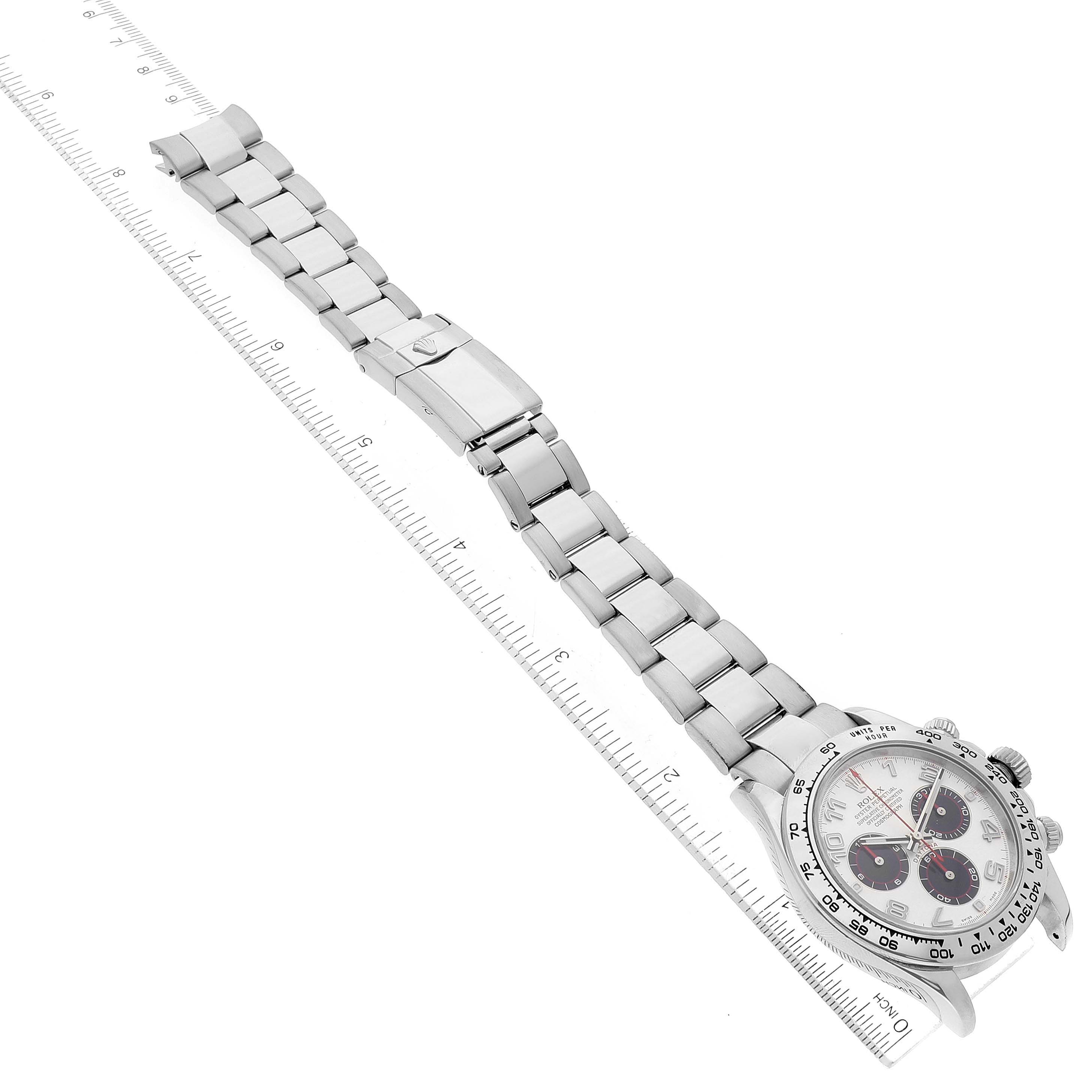 The image shows a Rolex Daytona 116509 Men's White Gold Silver Dial 116509 Men's White Gold Silver Dial watch, including the face, bezel, and a detailed view of the metal bracelet and clasp, next to a ruler.