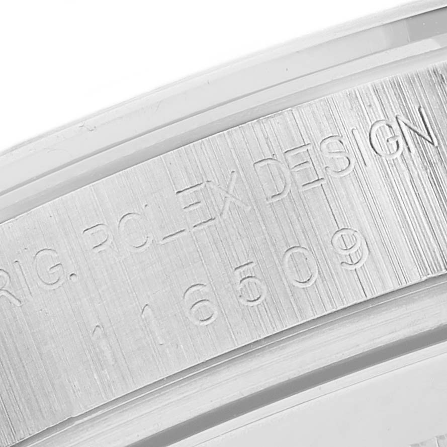This close-up image shows the engraved rehaut of a Rolex Daytona 116509 Men's White Gold Silver Dial 116509 Men's White Gold Silver Dial watch.