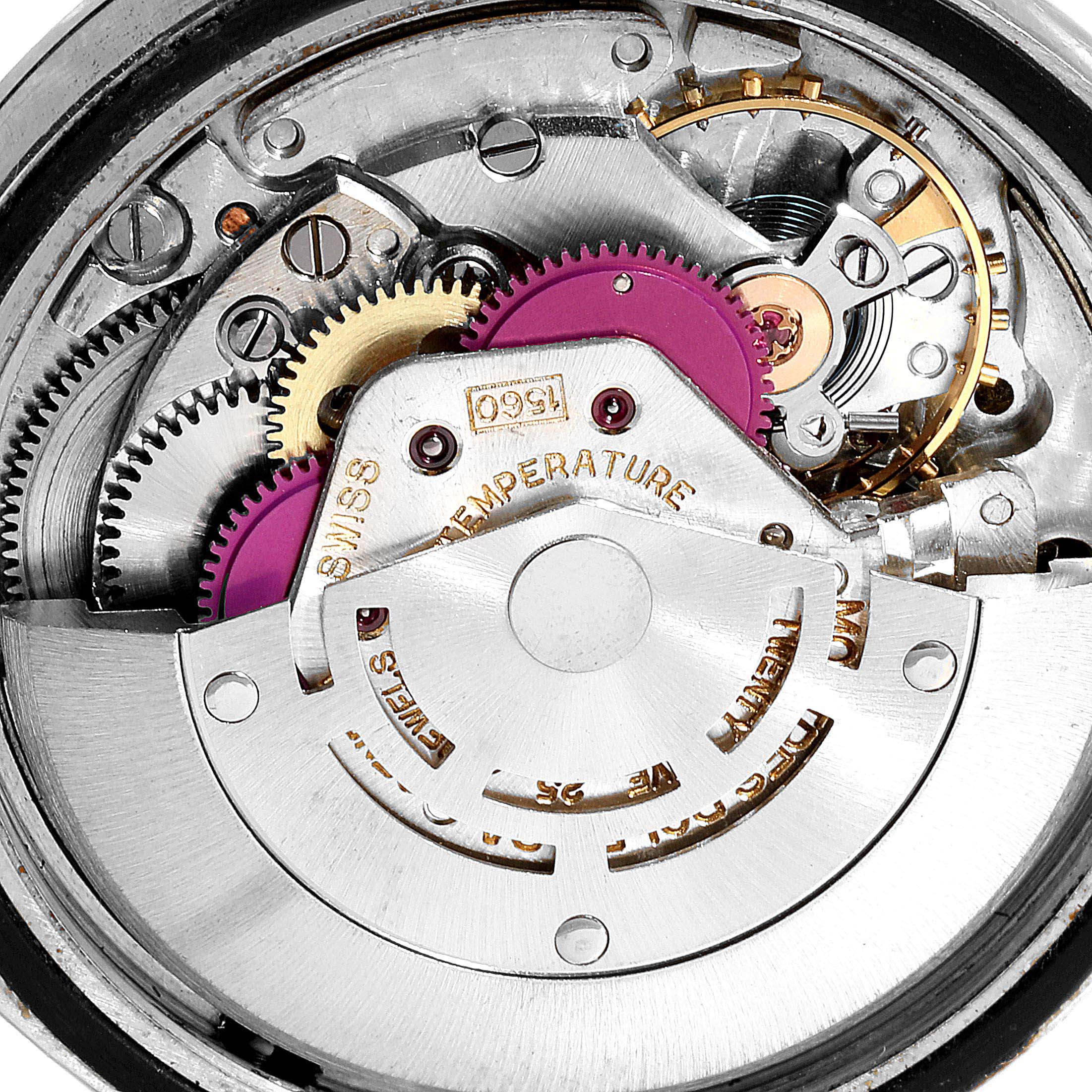 This image shows a close-up of the internal movement mechanisms of a Vintage Collection Rolex watch.