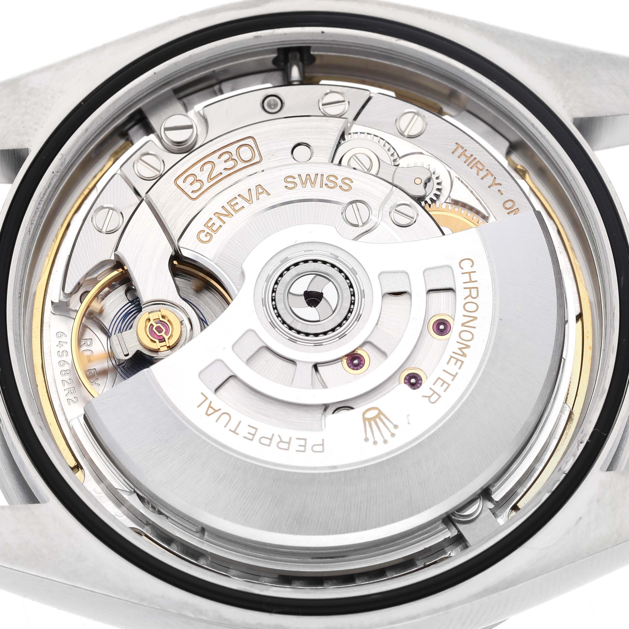 The image shows the movement of a Rolex Explorer 224270 Men's Stainless Steel Black Dial watch, focusing on the rotor and intricate mechanical parts from the back view.