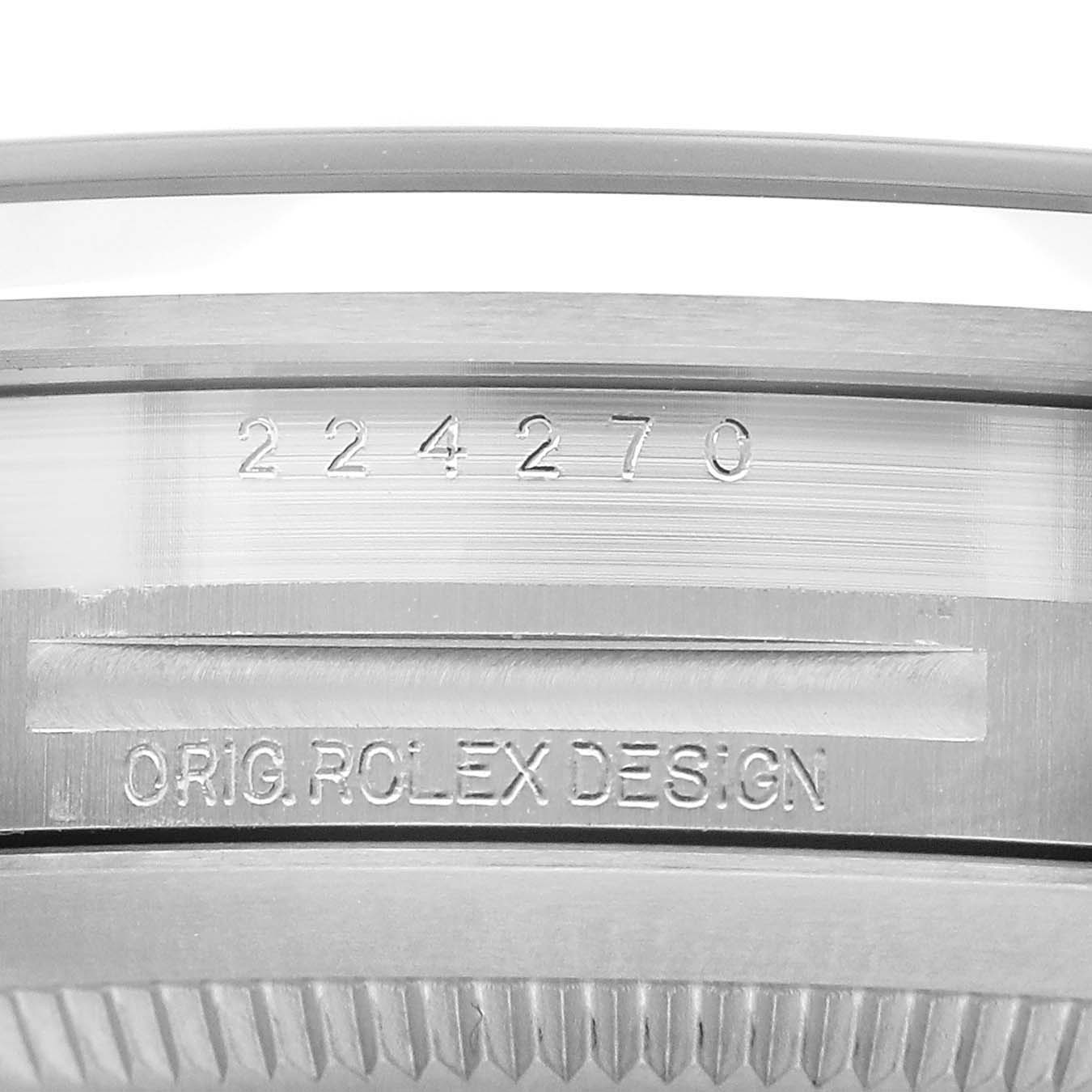 The image shows a close-up of the case side of a Rolex Explorer 224270 Men's Stainless Steel Black Dial, highlighting the reference number and "Orig. Rolex Design" engraving.