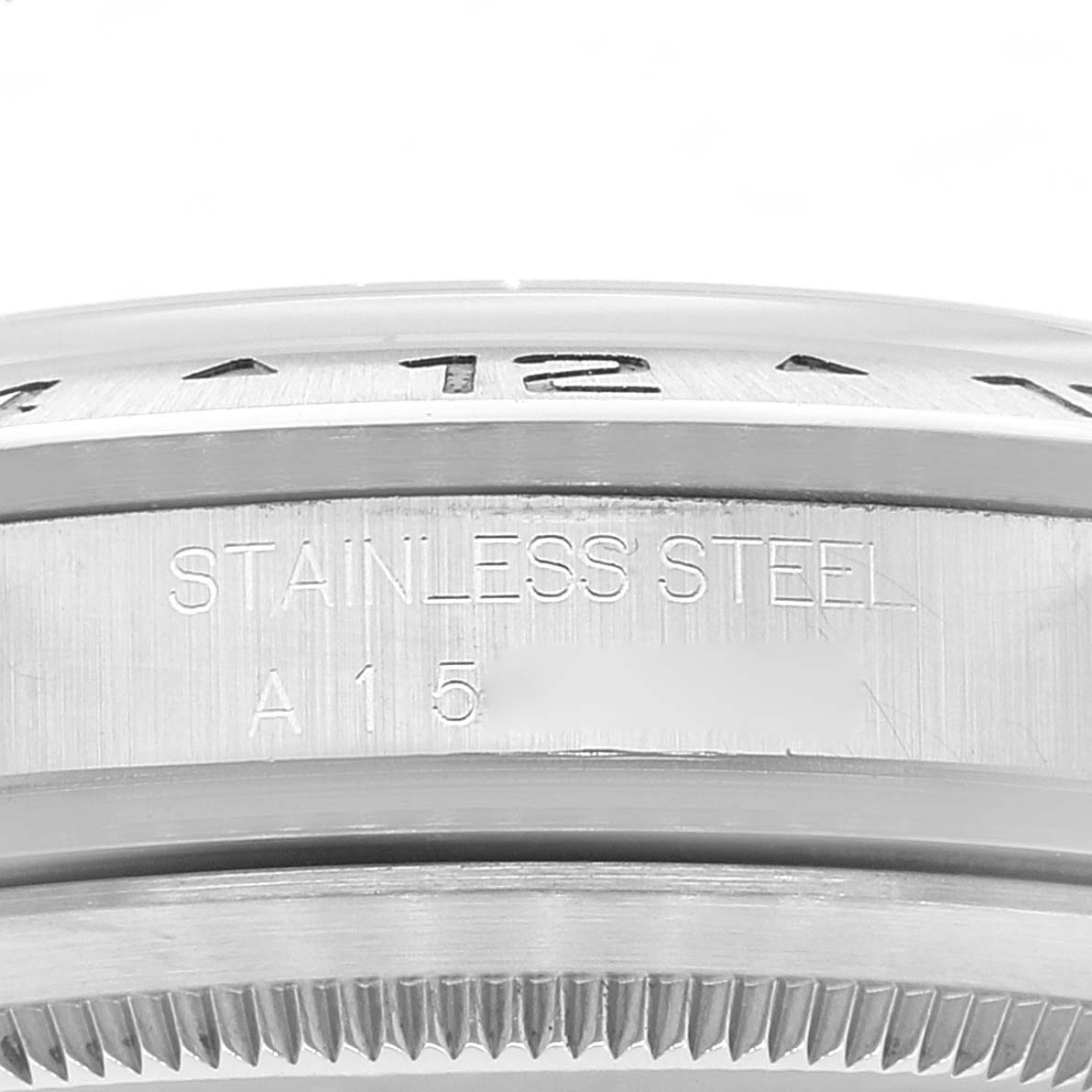 This image shows a close-up side view of the bezel and outer case of a Rolex Explorer 16570 Men's Stainless Steel White Dial 16570 Men's Stainless Steel White Dial watch.