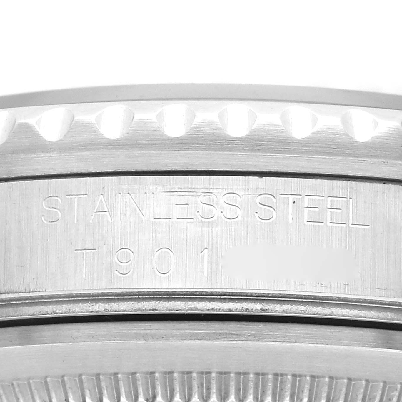 This close-up image shows the side of the bezel and the engraved serial number on the stainless steel case of a Rolex GMT-Master 16700 Men's Stainless Steel Black Dial 16700 Men's Stainless Steel Black Dial.