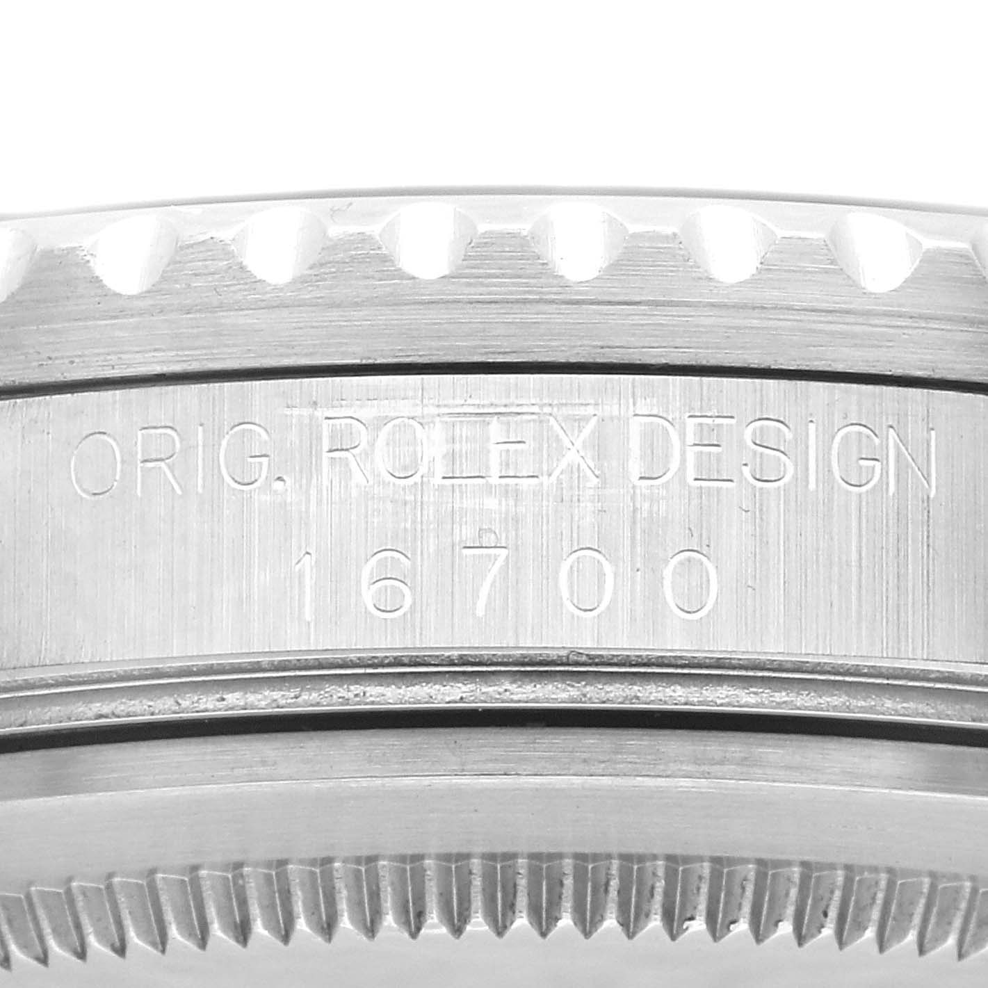 The image shows a close-up view of the case side with the engraved "ORIG. ROLEX DESIGN 16700" on the Rolex GMT-Master 16700 Men's Stainless Steel Black Dial 16700 Men's Stainless Steel Black Dial watch.