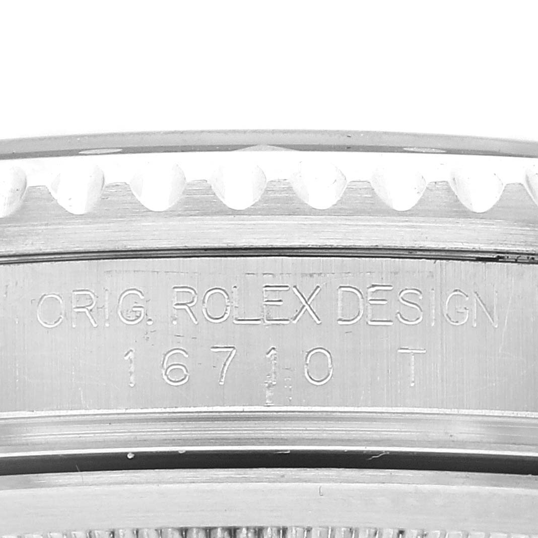 This image shows a close-up of the side engraving and bezel teeth of a Rolex GMT-Master 16710 Men
s Stainless Steel Black Dial 16710 Men
s Stainless Steel Black Dial model 16710T watch.
