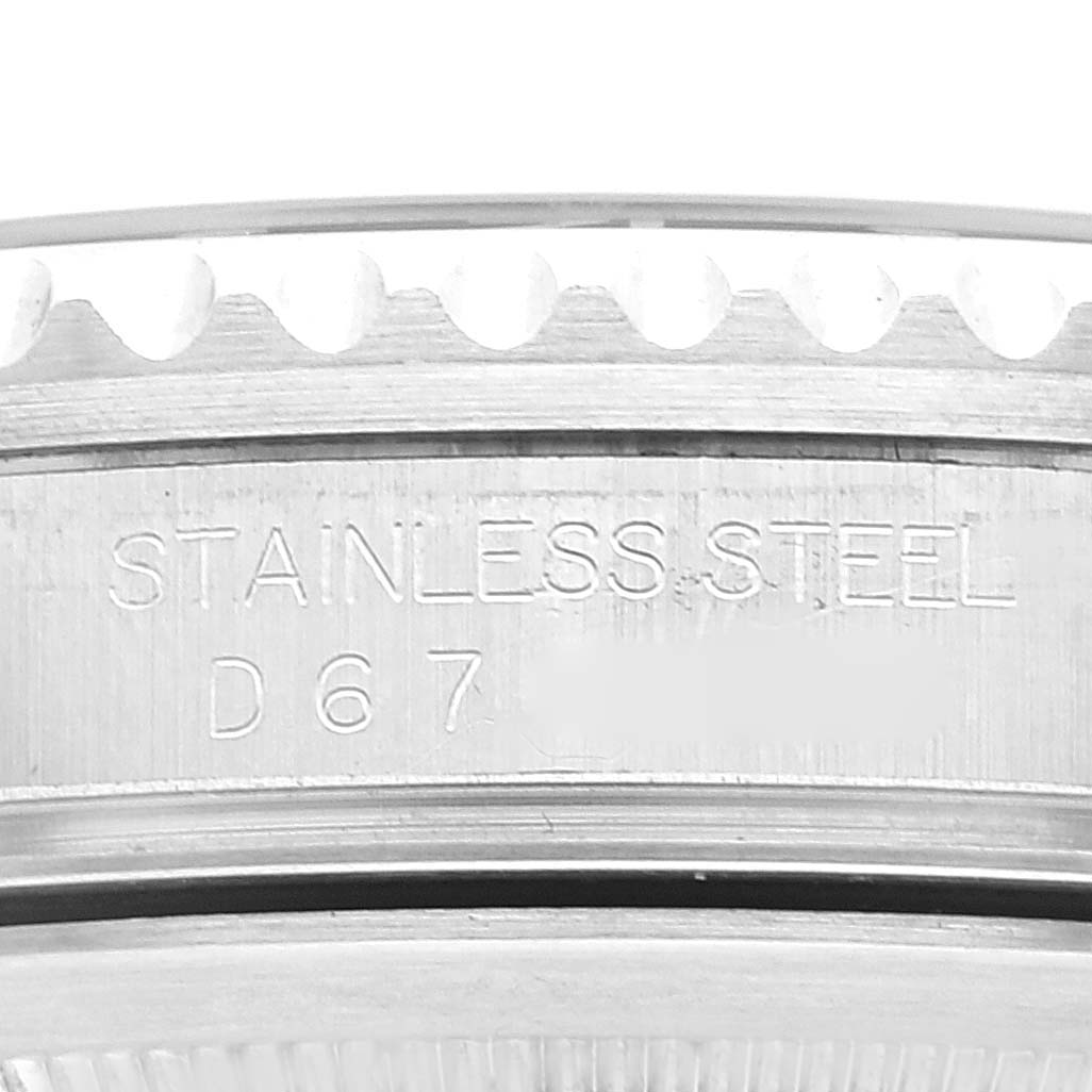 This close-up image shows the stainless steel case and engraving on the side of a Rolex GMT-Master 16710 Men
s Stainless Steel Black Dial 16710 Men
s Stainless Steel Black Dial watch.