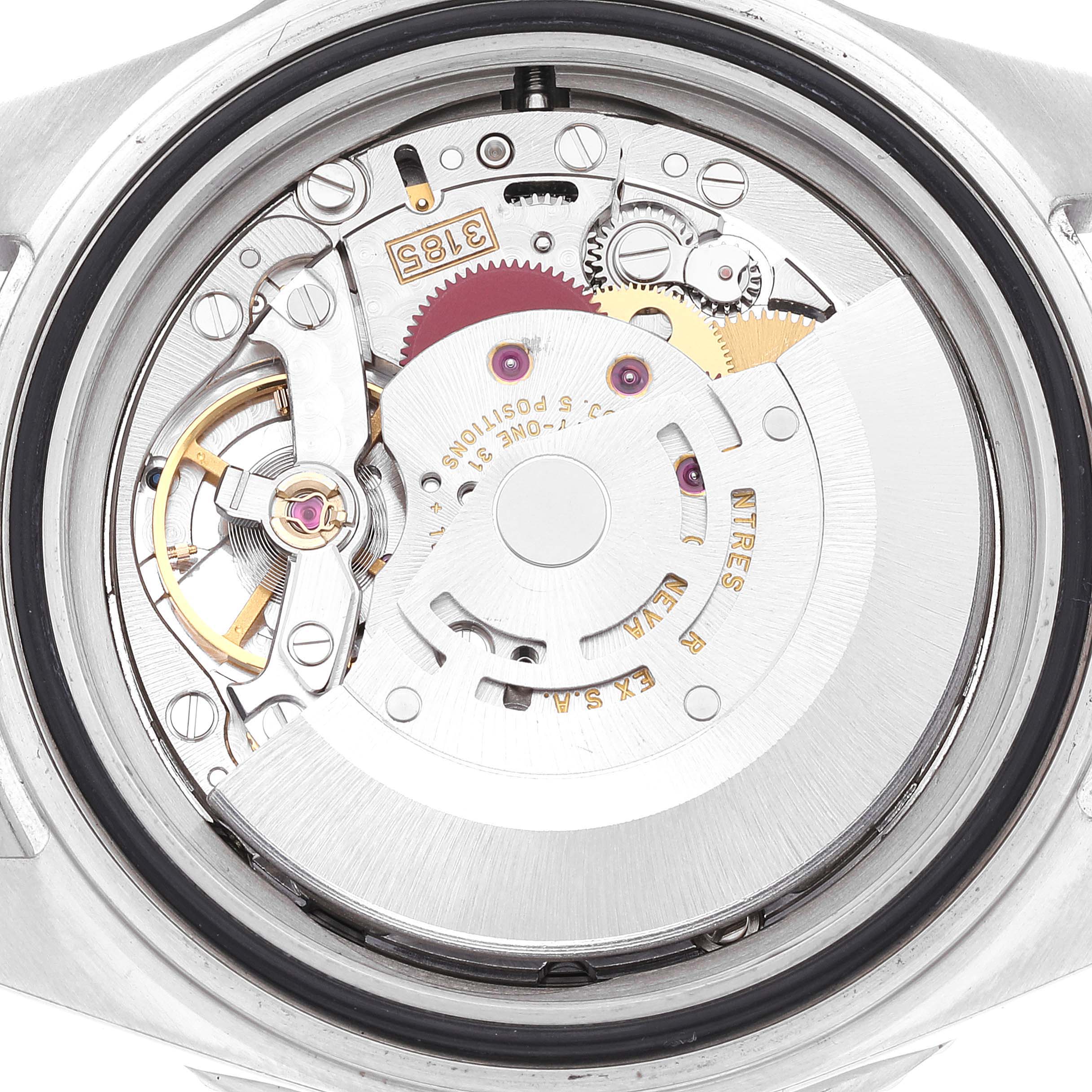 The image shows the internal mechanics of a Rolex GMT-Master 16710 Men
s Stainless Steel Black Dial 16710 Men
s Stainless Steel Black Dial watch from a back angle, highlighting gears and the rotor.