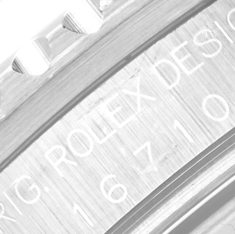 The image shows a close-up view of the engraved inner case and bezel teeth of a Rolex GMT-Master 16710 Men's Stainless Steel Black Dial 16710 Men's Stainless Steel Black Dial watch.