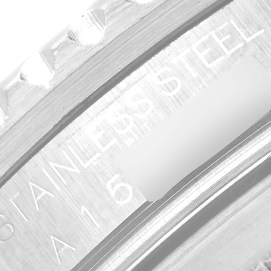 This image shows a close-up of the bezel and engraved serial number on a Rolex GMT-Master 16710 Men's Stainless Steel Black Dial 16710 Men's Stainless Steel Black Dial watch.