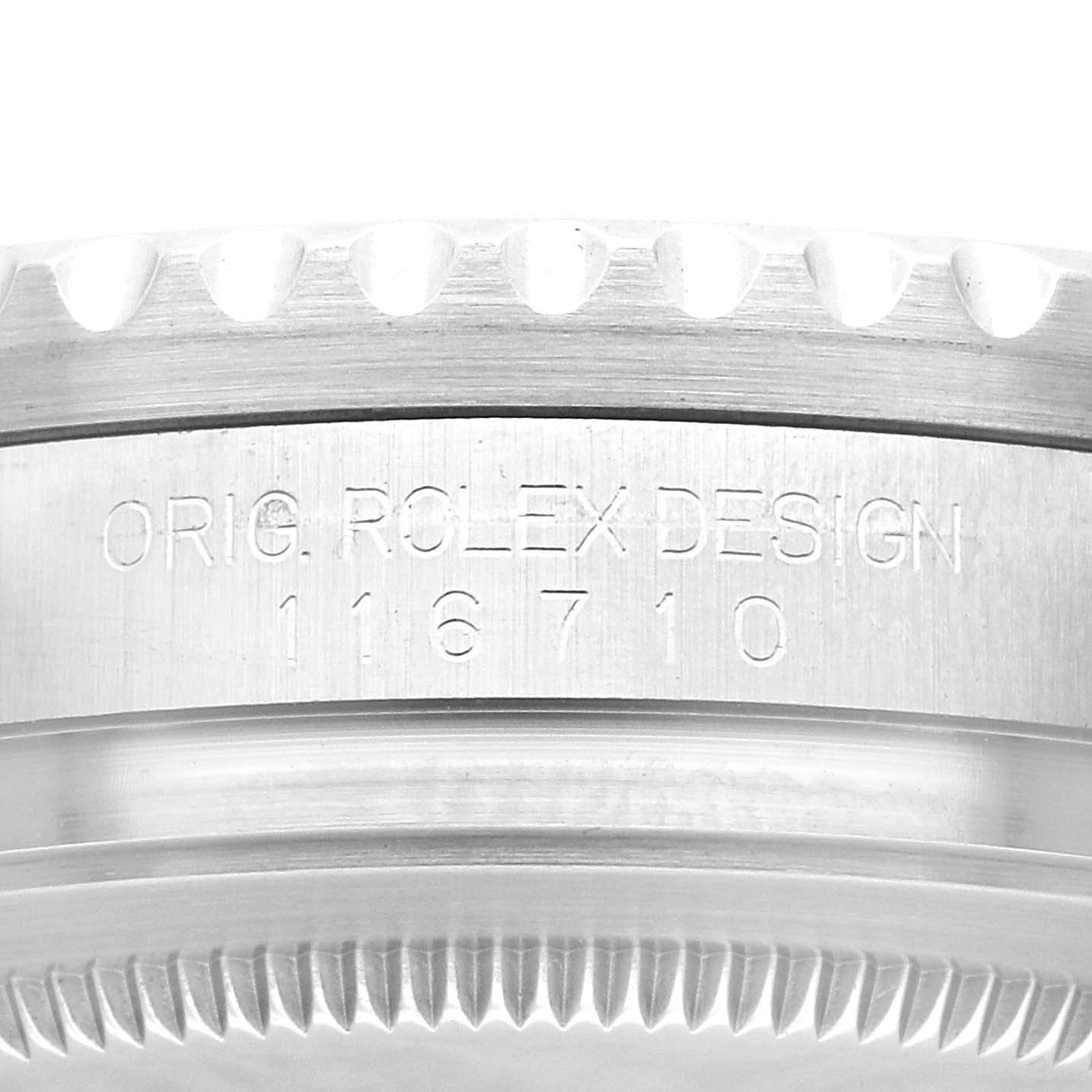 The image shows a close-up of the side of a Rolex GMT-Master 116710 Men
s Stainless Steel Black Dial 116710 Men
s Stainless Steel Black Dial, featuring the engraved model number 116710.