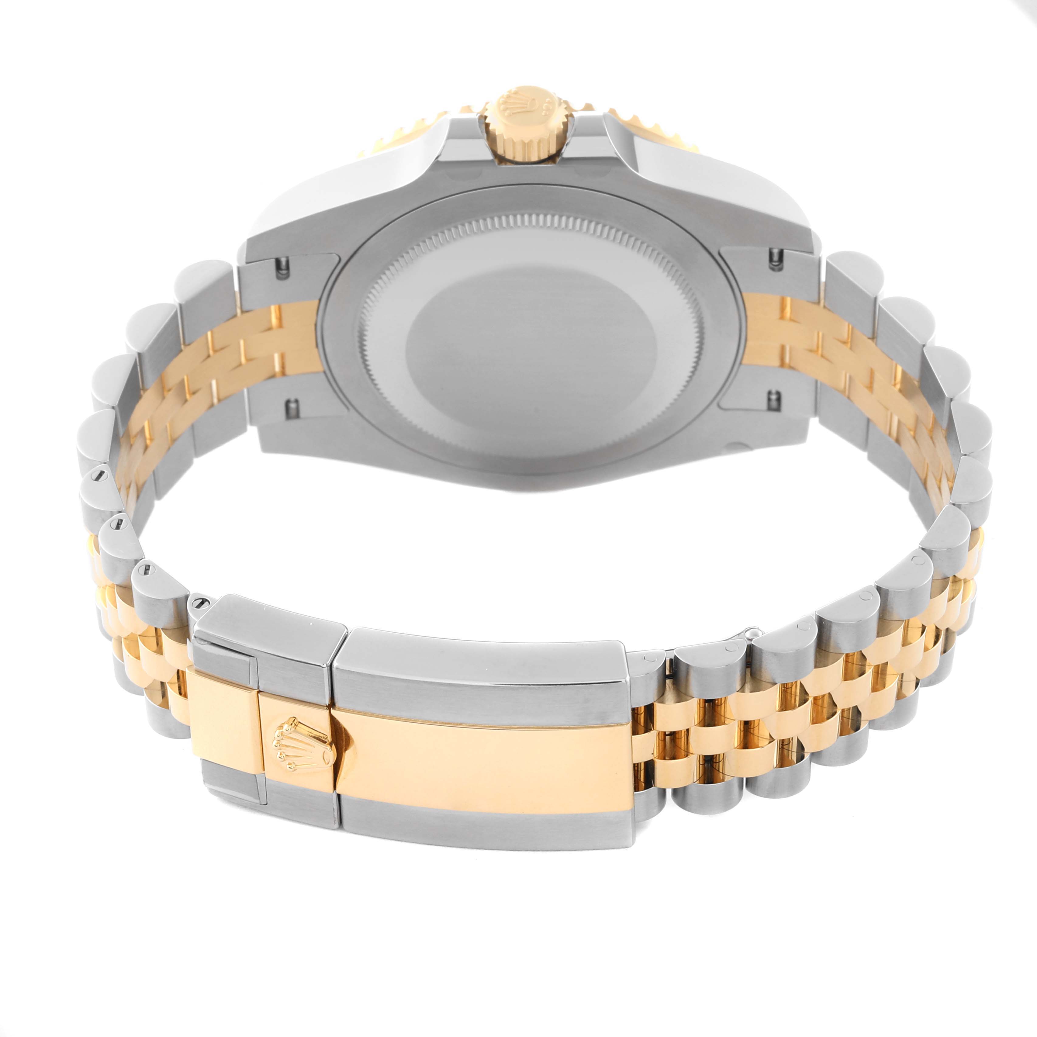 The image shows the back casing and two-tone bracelet clasp of a Rolex GMT-Master 126713 Men's Steel and Gold (two tone) Black Dial 126713 Men's Steel and Gold (two tone) Black Dial watch.