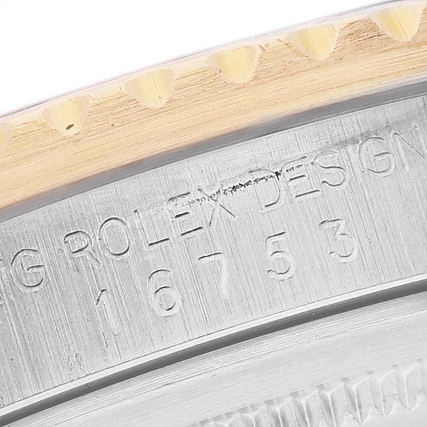 Close-up of the case edge and bezel of a Rolex Vintage Collection 16753 Men's Steel and Gold (two tone) Brown Dial 16753 Men's Steel and Gold (two tone) Brown Dial model, showing the serial number engraving.