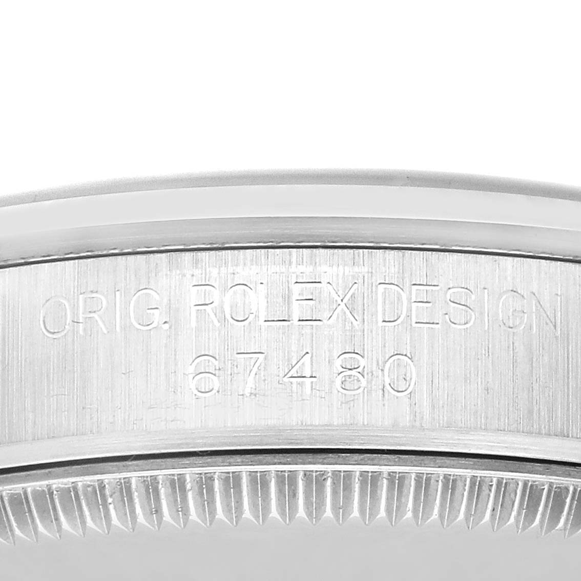 This close-up image shows the engraved side of the bezel on a Mid-Size Rolex watch model.