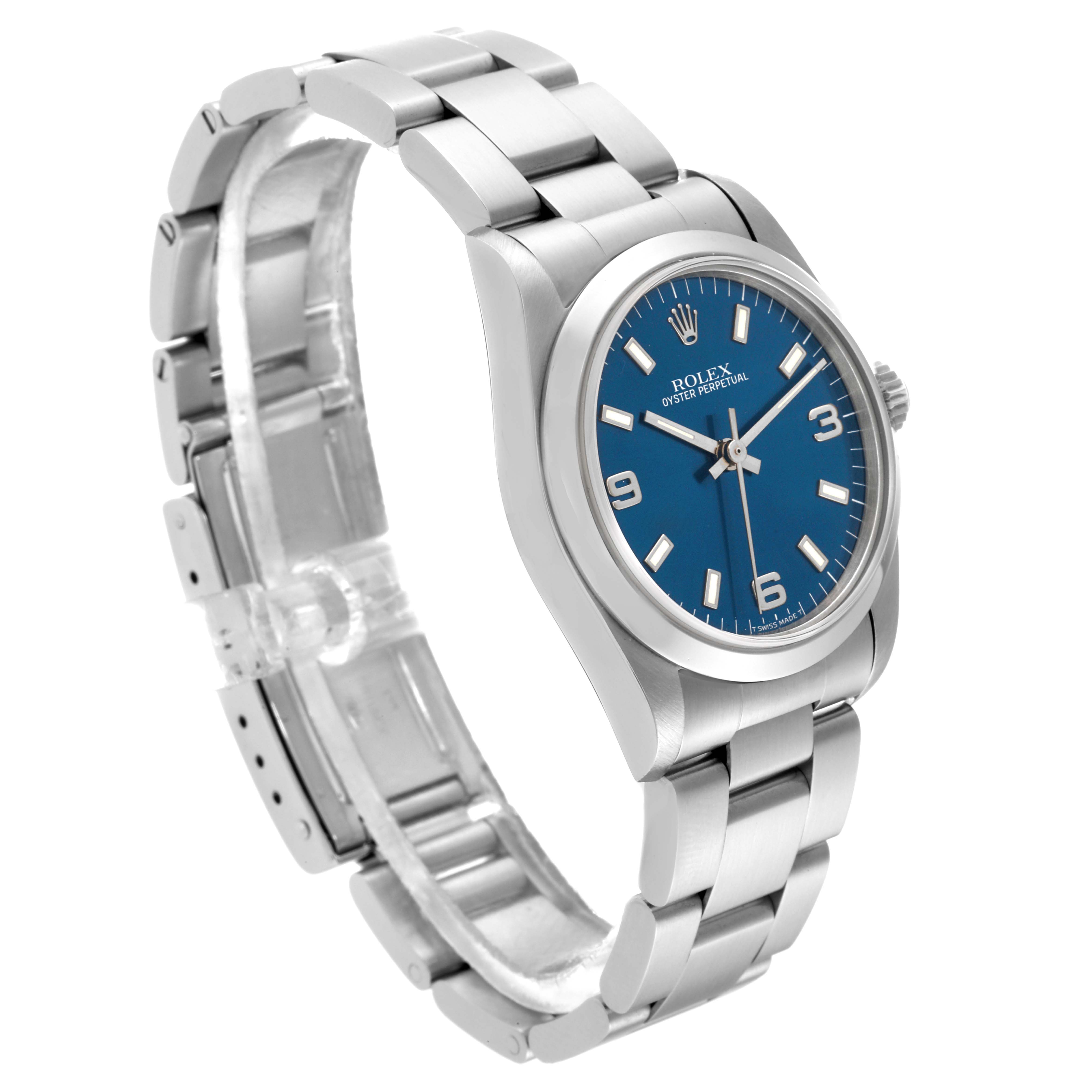 The Rolex Mid-Size 67480 Women
s Stainless Steel Blue Dial 67480 Women
s Stainless Steel Blue Dial model watch is shown at a three-quarter angle, highlighting its blue dial, bezel, crown, and stainless steel bracelet.