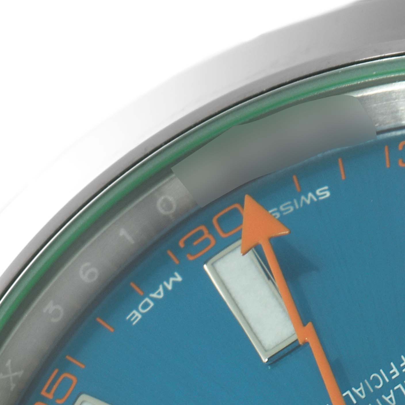 This close-up photo of the Rolex Milgauss 116400GV Men
s Stainless Steel Blue Dial 116400GV Men
s Stainless Steel Blue Dial watch shows part of the blue dial with orange markers and the orange lightning bolt seconds hand.