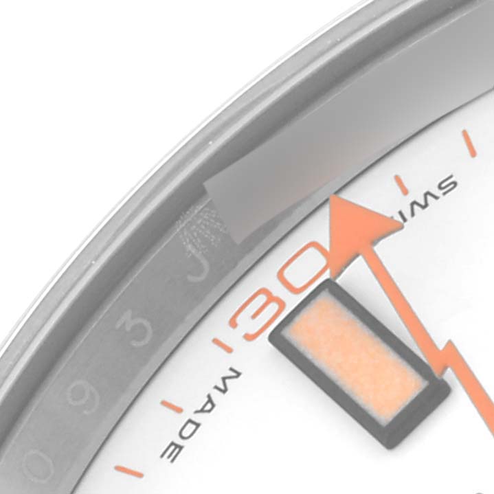 The image shows a close-up of the dial and edge of a Rolex Milgauss 116400 Men
s Stainless Steel White Dial 116400 Men
s Stainless Steel White Dial watch, highlighting the 30-second marker and part of the orange lightning bolt-shaped second hand.