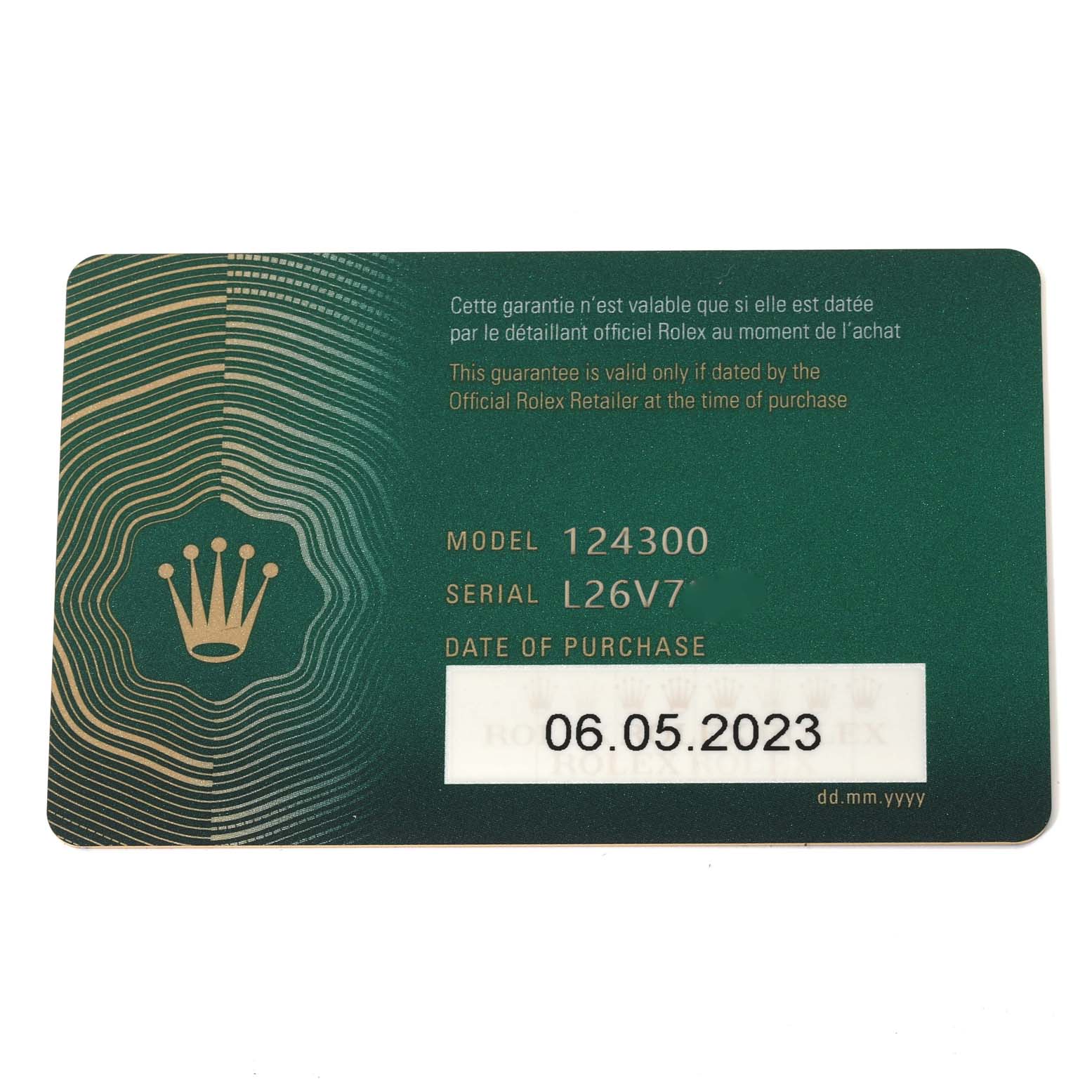 The image shows the guarantee card for the Rolex Oyster Perpetual 124300 Men's Stainless Steel Green Dial 124300 Men's Stainless Steel Green Dial model 124300 with the serial number and date of purchase visible.