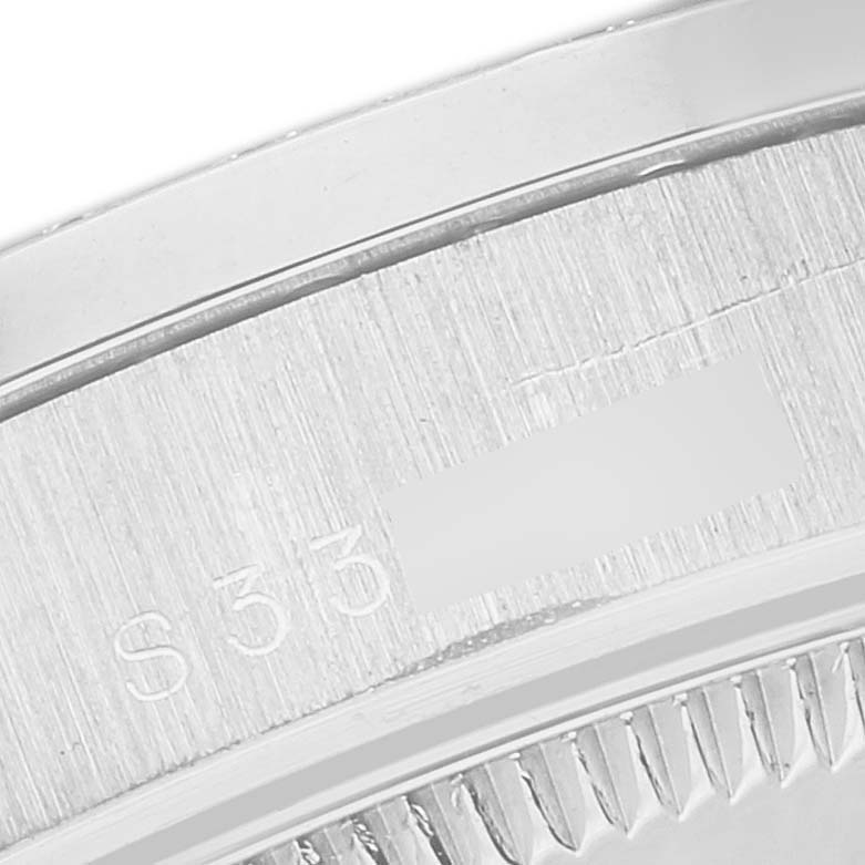 This image shows a close-up of the engraved serial number on the case back of a Rolex President 68286 Women's Platinum Silver Dial 68286 Women's Platinum Silver Dial model watch.