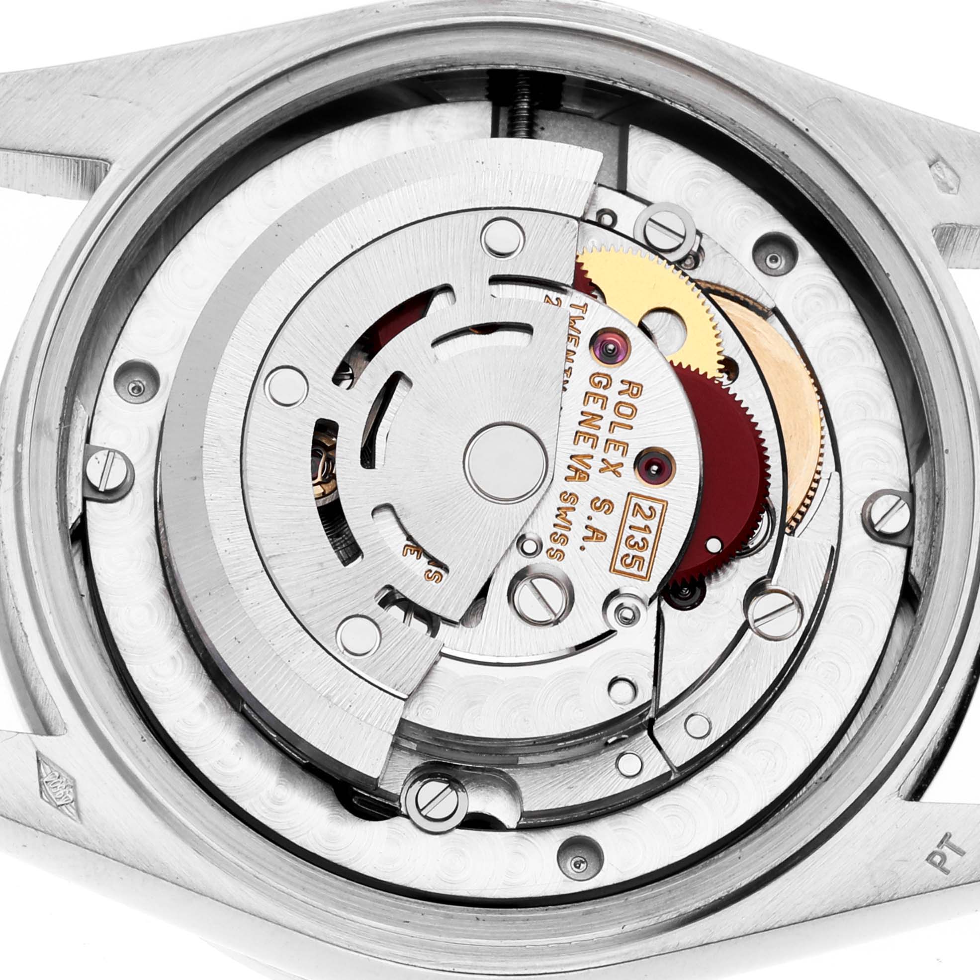 The image shows the intricate internal mechanism of a Rolex President 68286 Women's Platinum Silver Dial 68286 Women's Platinum Silver Dial model watch, displaying its gears and components.