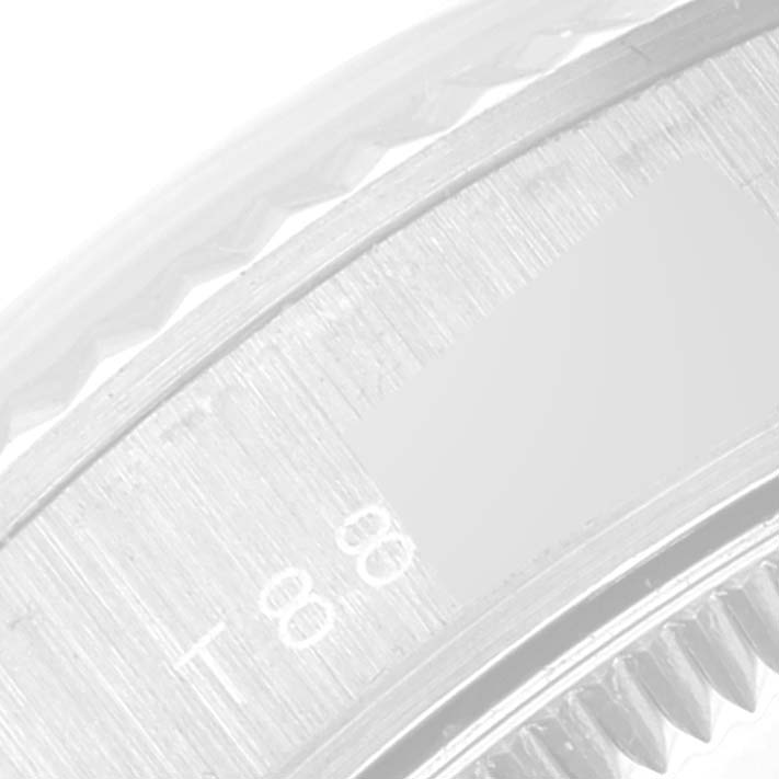 The image shows a close-up of the bezel and a part of the dial of a Rolex President 68279 Women's White Gold Silver Dial 68279 Women's White Gold Silver Dial model watch.