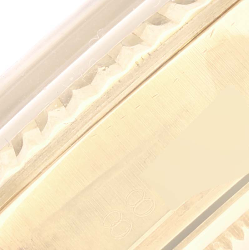 The close-up image shows the fluted bezel and part of the case side of a Rolex Vintage Collection 1803 Men's Yellow Gold Champagne Dial 1803 Men's Yellow Gold Champagne Dial watch.
