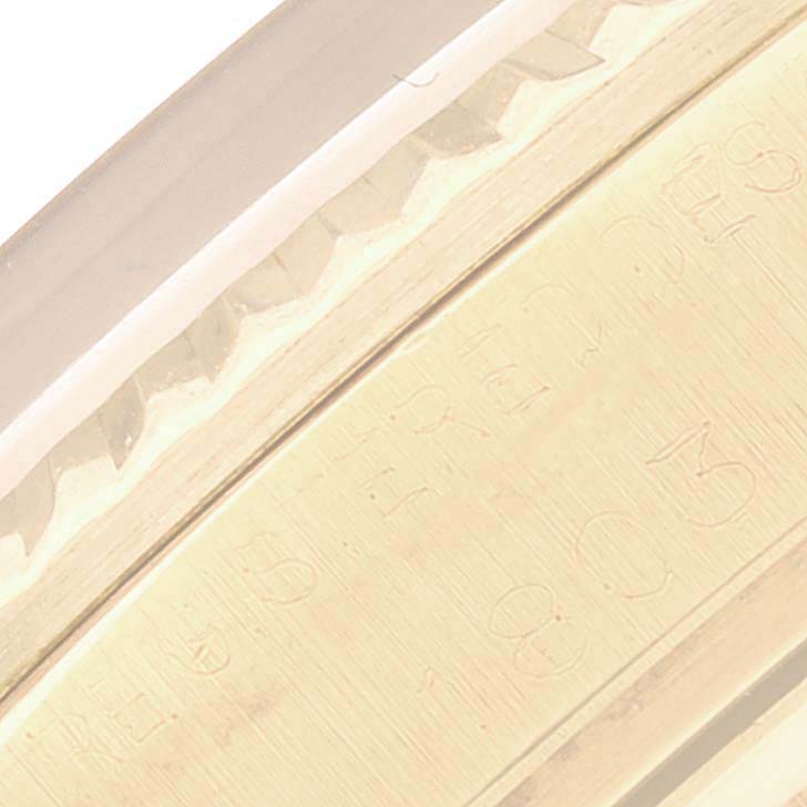 The image shows a close-up angle of the engraved case side of a Rolex Vintage Collection 1803 Men's Yellow Gold Champagne Dial 1803 Men's Yellow Gold Champagne Dial watch.