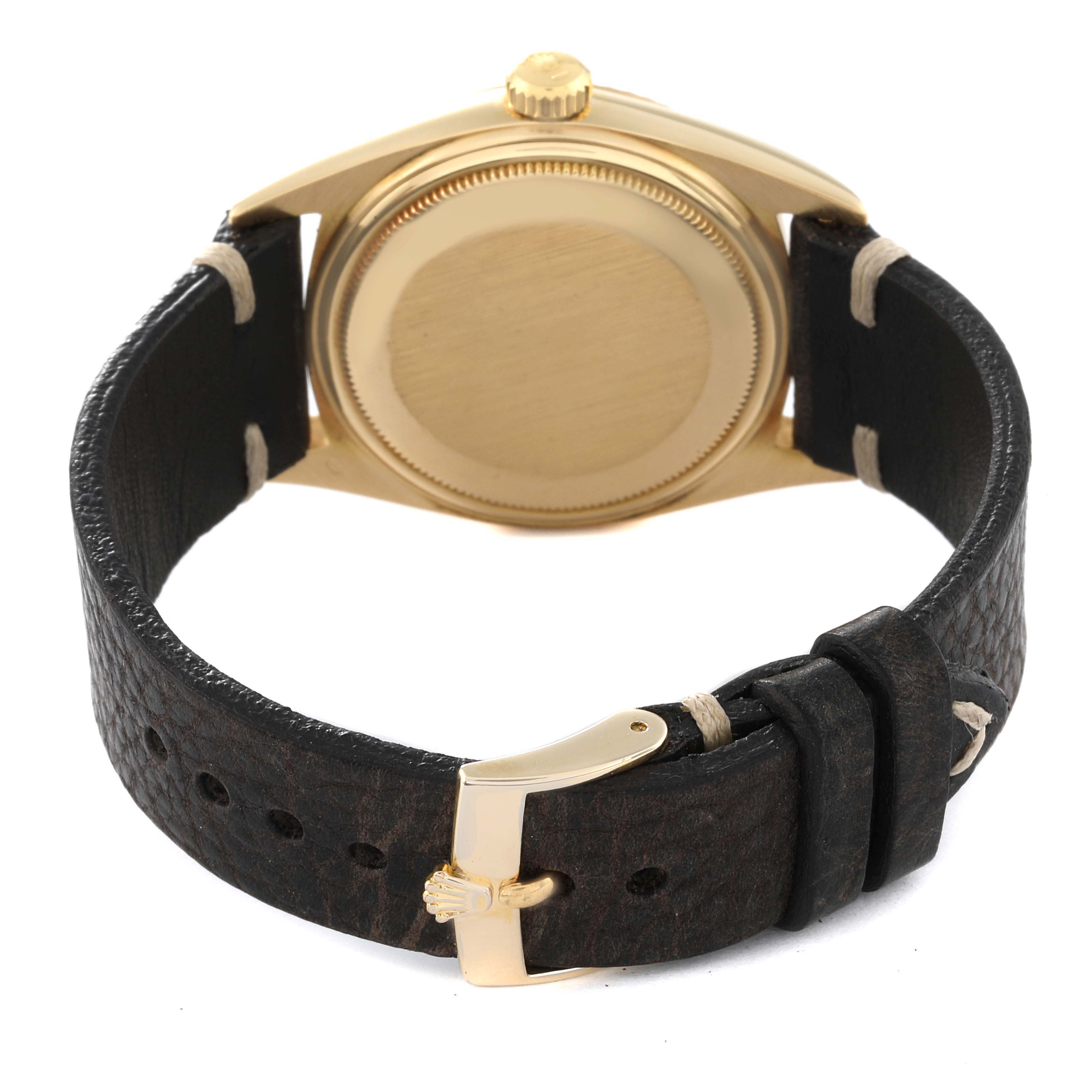 The image shows the back and strap of a Rolex Vintage Collection 1803 Men's Yellow Gold Champagne Dial 1803 Men's Yellow Gold Champagne Dial model with a leather band and gold buckle from a rear angle.