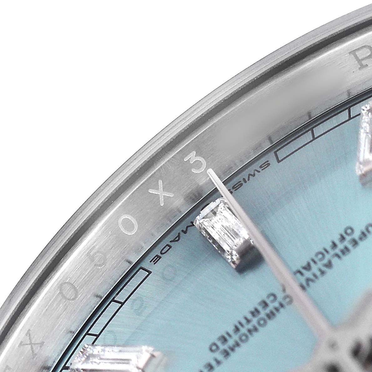 The image shows a close-up of the dial and bezel of the Rolex President 128236 Men's Platinum Black Dial model, highlighting the hour markers and text.