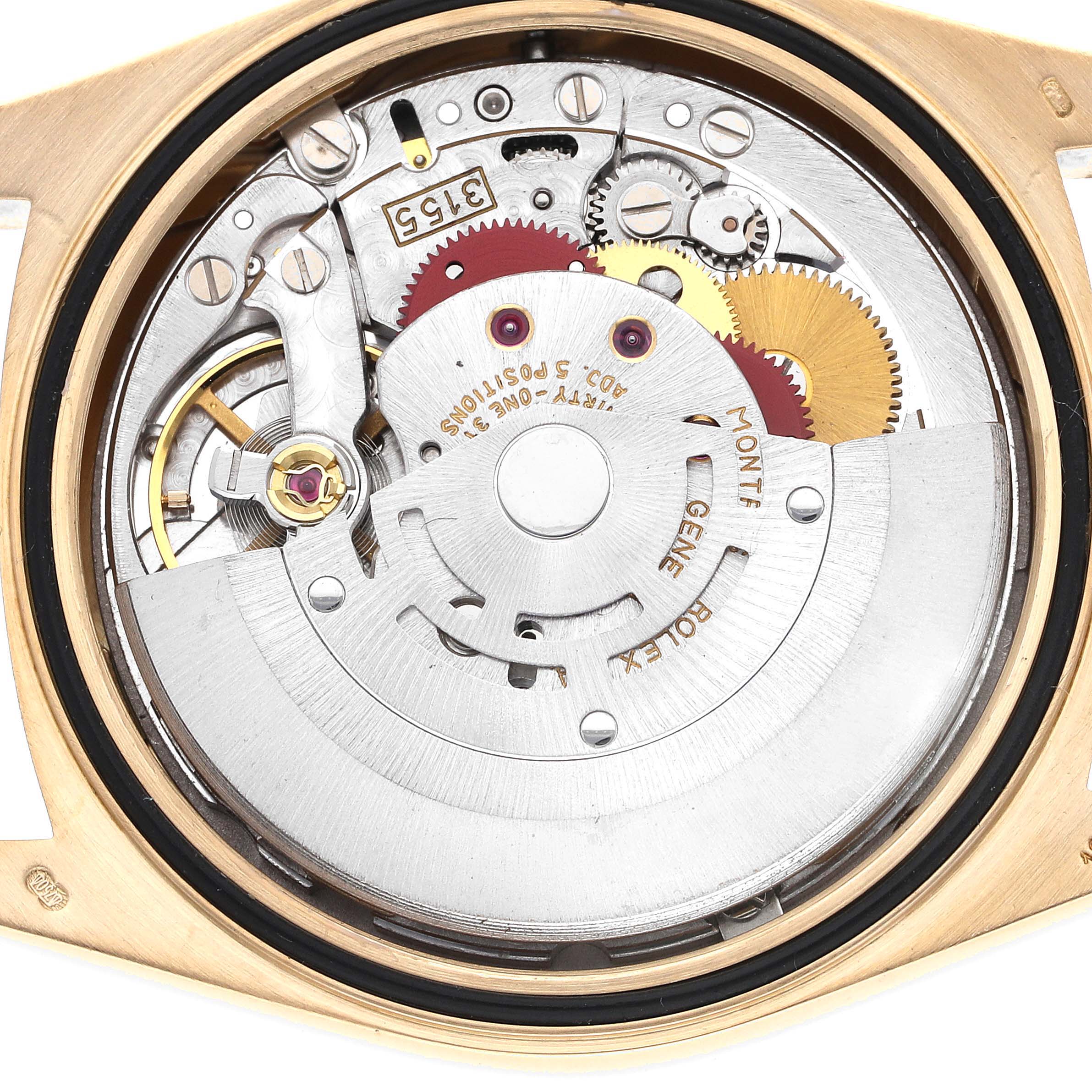 The image shows the detailed inner mechanism of a Rolex President 18238 Men's Yellow Gold White Dial 18238 Men's Yellow Gold White Dial model watch, viewed from the back with parts like gears and rotors visible.