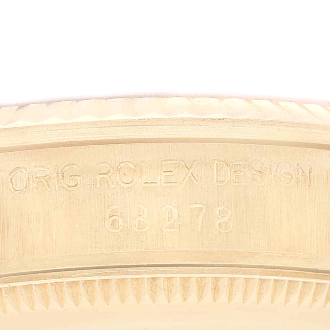This close-up angle showcases the engraved model number on the case of the Rolex President 68278 Women
s Yellow Gold Champagne Dial 68278 Women
s Yellow Gold Champagne Dial watch.