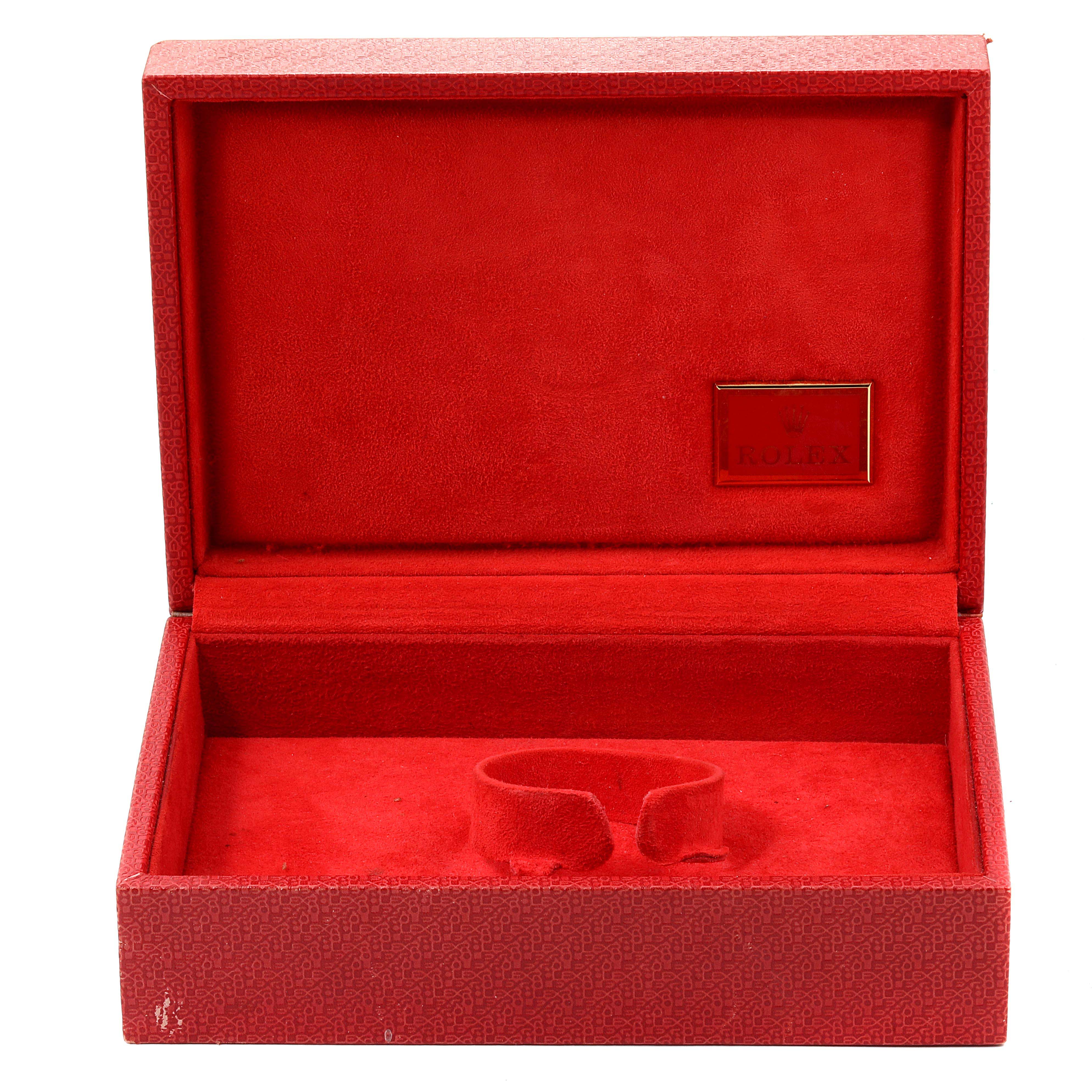 This image shows an open red box for a Rolex President 69136 Women
s Platinum Silver Dial 69136 Women
s Platinum Silver Dial model watch, highlighting the internal holder and branding.