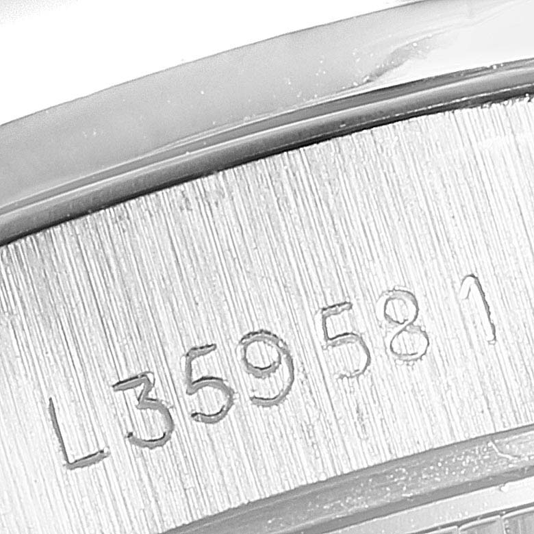 This image shows a close-up of the serial number engraved on the case of a Rolex President 69136 Women
s Platinum Silver Dial 69136 Women
s Platinum Silver Dial model watch.