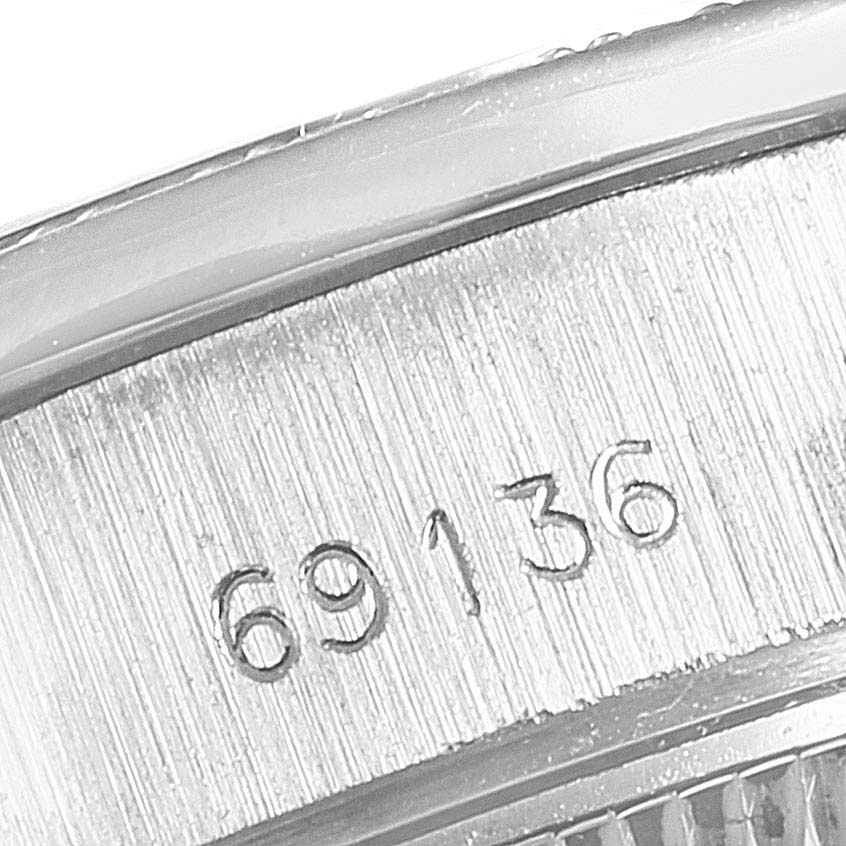 This close-up image shows the engraved model number on the side of the Rolex President 69136 Women
s Platinum Silver Dial 69136 Women
s Platinum Silver Dial watch case.