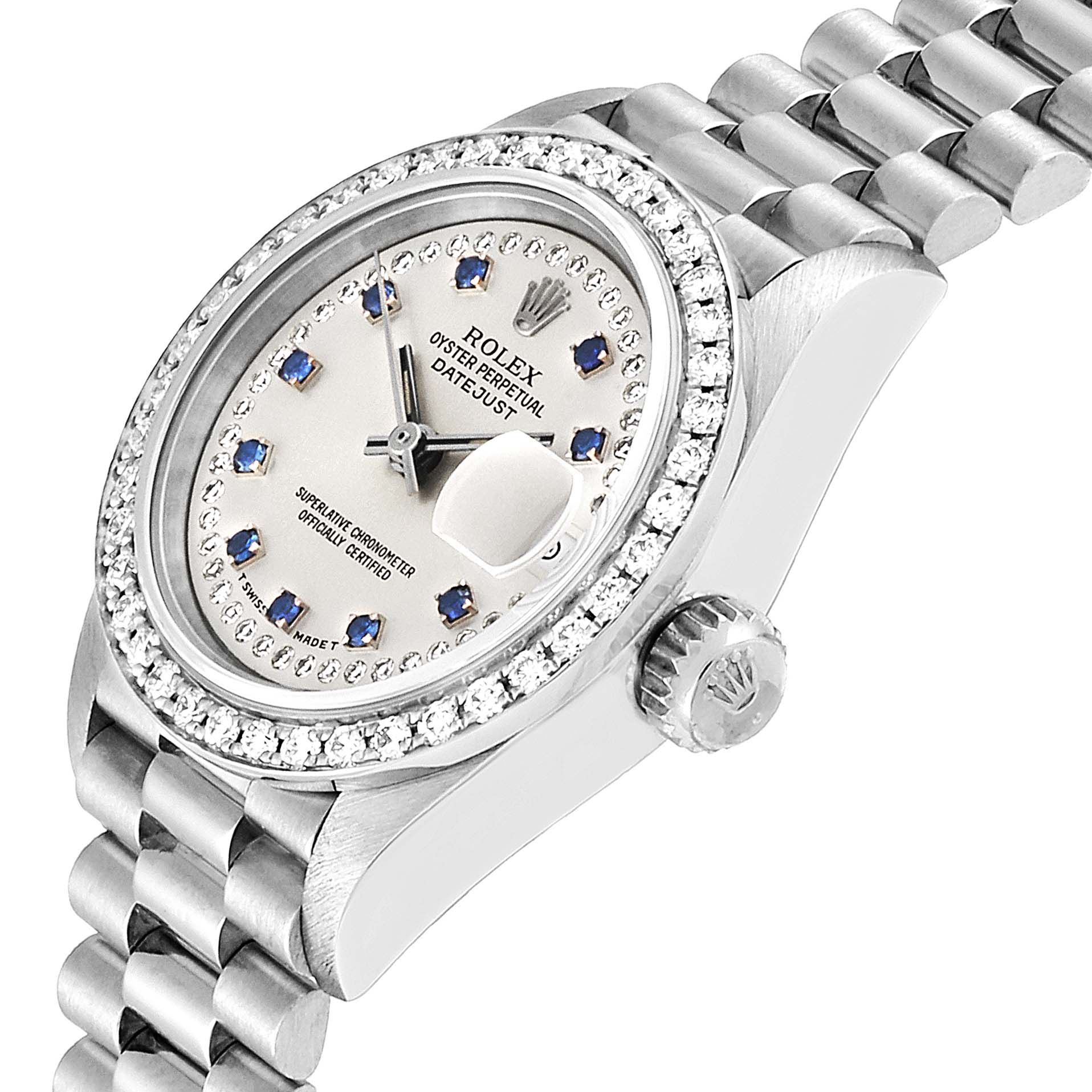 This image shows a Rolex President 69136 Women
s Platinum Silver Dial 69136 Women
s Platinum Silver Dial model watch from a side angle, highlighting the bezel, crown, and part of the bracelet.