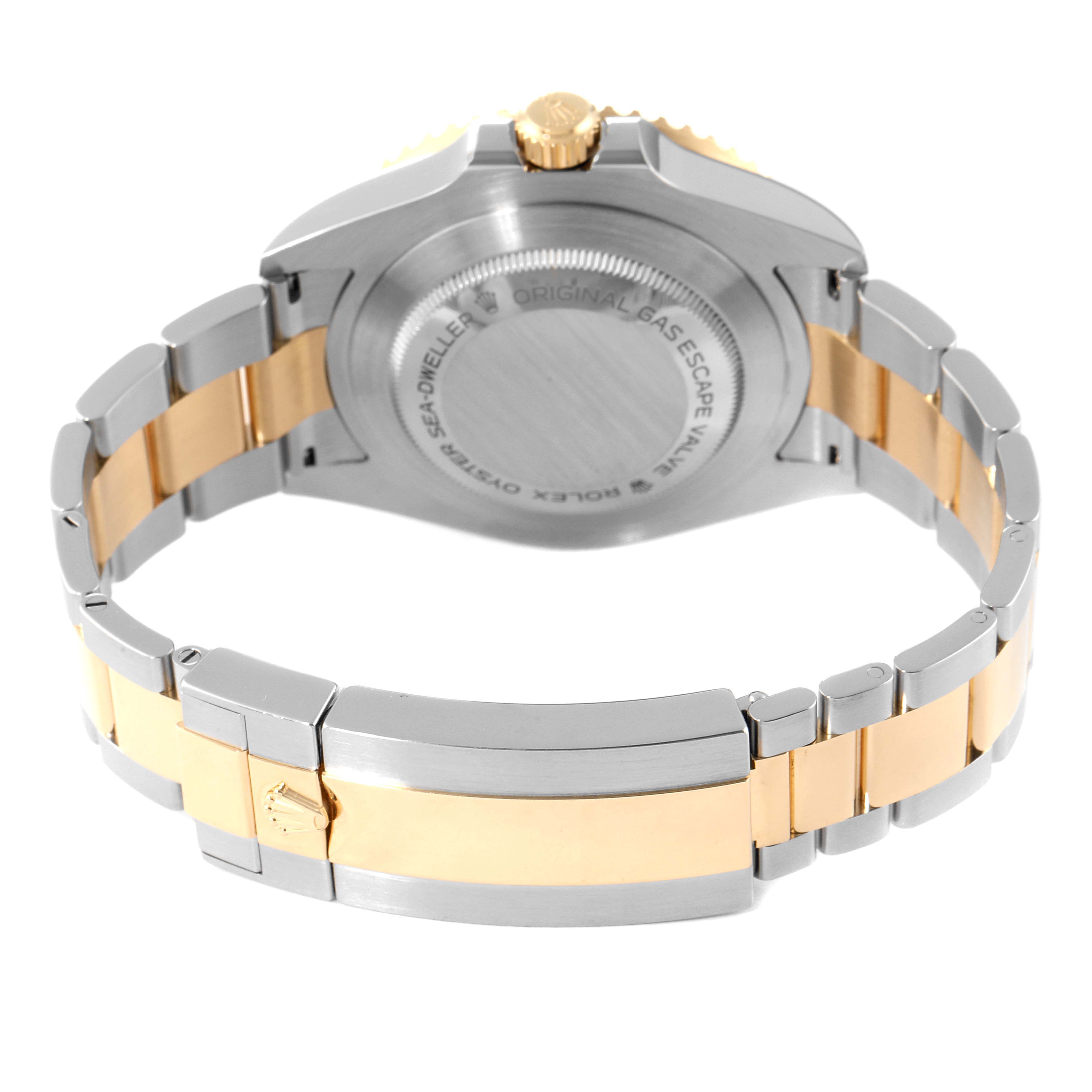 This image shows the back and bracelet of a Rolex Sea-Dweller 126603 Men's Steel and Gold (two tone) Black Dial 126603 Men's Steel and Gold (two tone) Black Dial watch, highlighting its silver and gold elements.