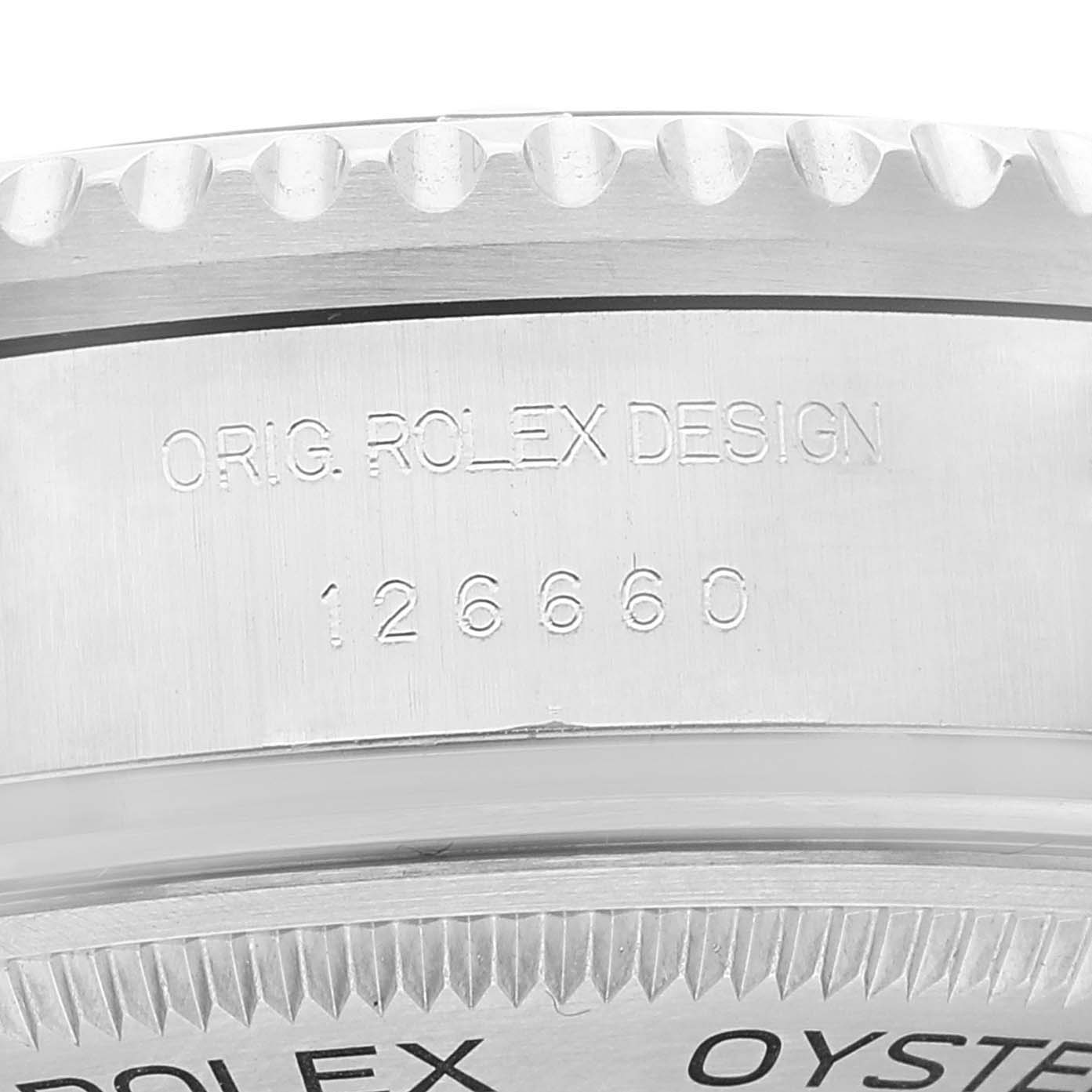 The image shows a close-up of the side of a Rolex Sea-Dweller 126660 Men
s Stainless Steel Blue Dial 126660 Men
s Stainless Steel Blue Dial watch, highlighting the model number 126660 and the text "ORIG. ROLEX DESIGN."