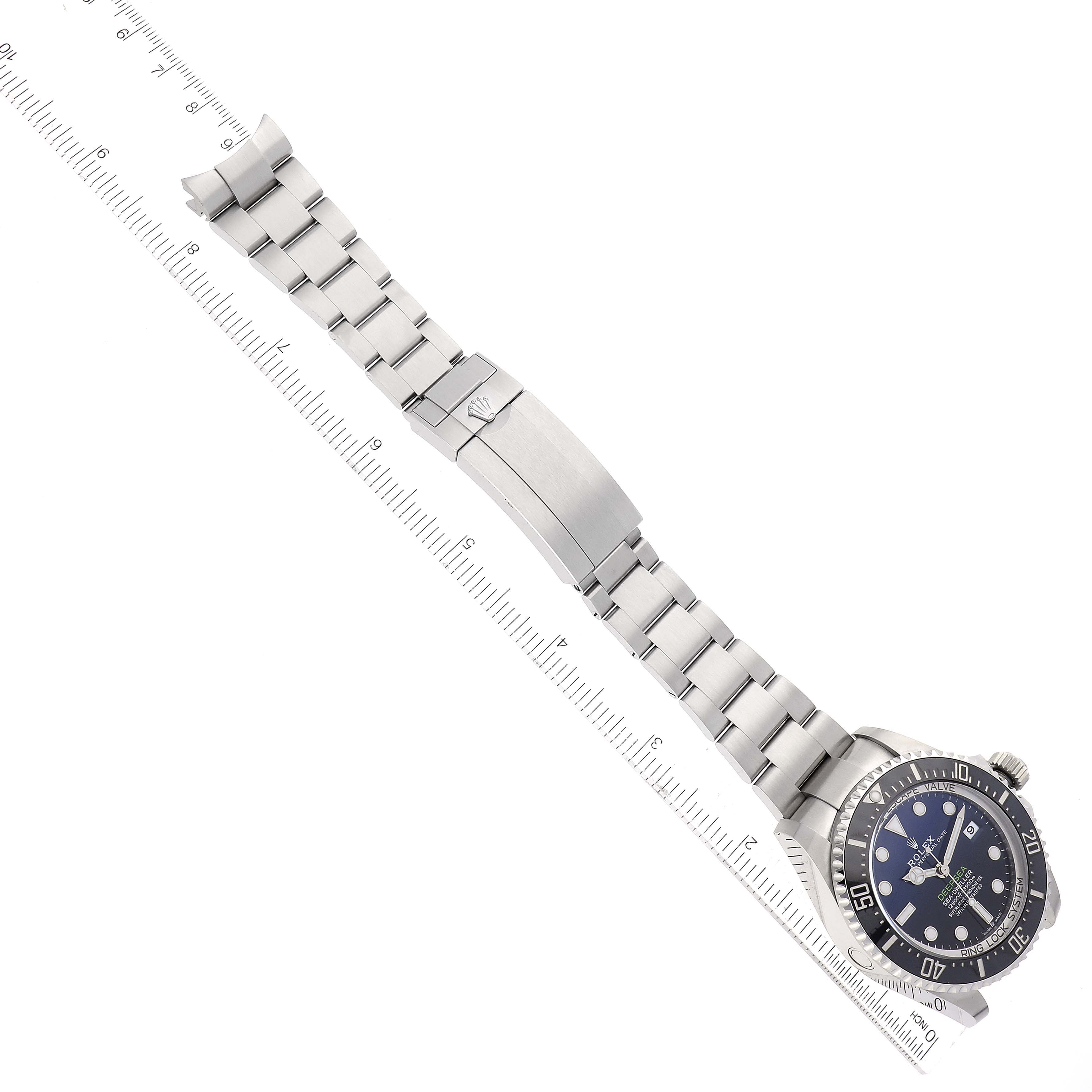 The image shows a Rolex Sea-Dweller 136660 Men's Stainless Steel Blue Dial 136660 Men's Stainless Steel Blue Dial watch laid flat, displaying the full metal bracelet and the face of the watch.