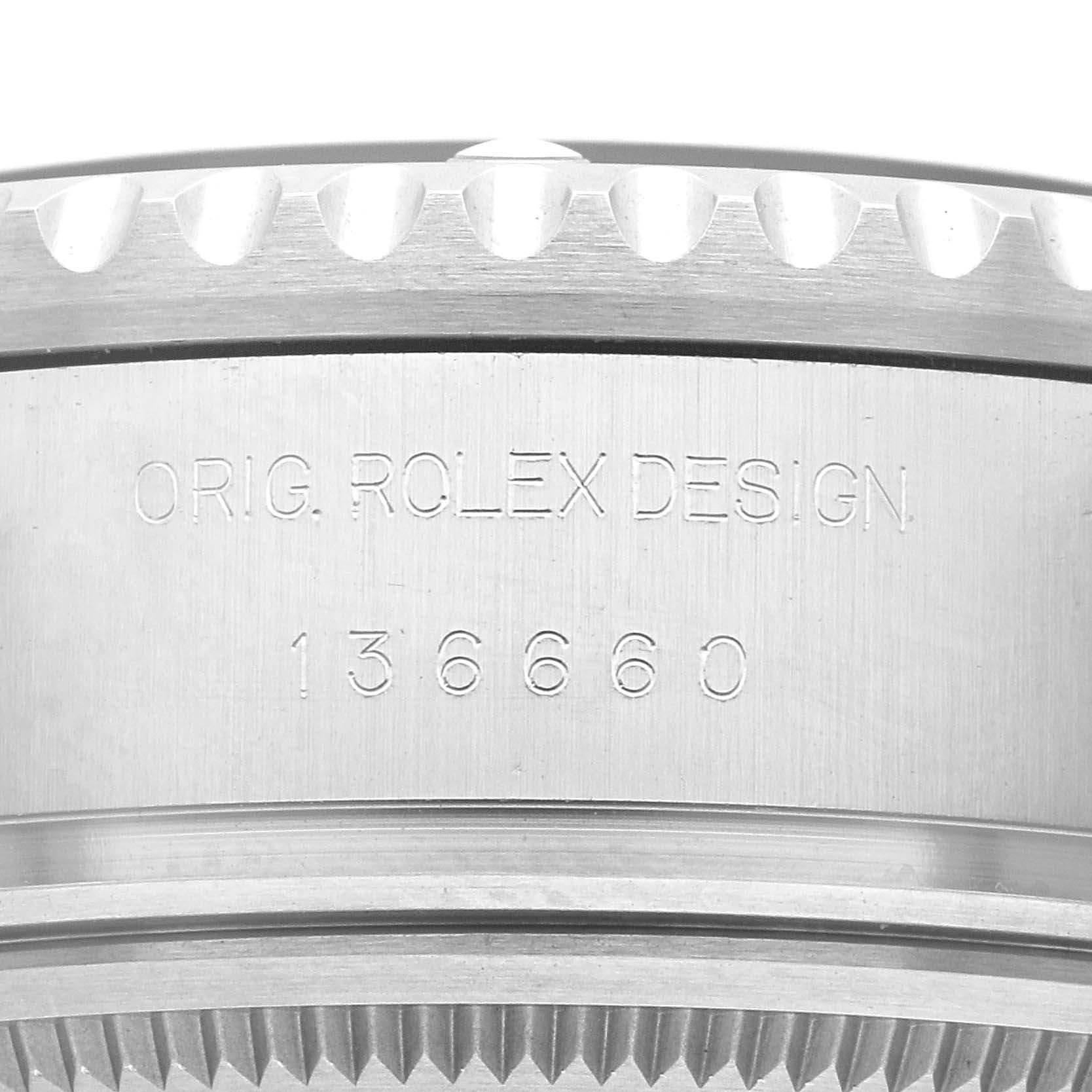 This image shows a close-up view of the side of a Rolex Sea-Dweller 136660 Men's Stainless Steel Blue Dial 136660 Men's Stainless Steel Blue Dial watch case, highlighting the engraved model number and "ORIG. ROLEX DESIGN."