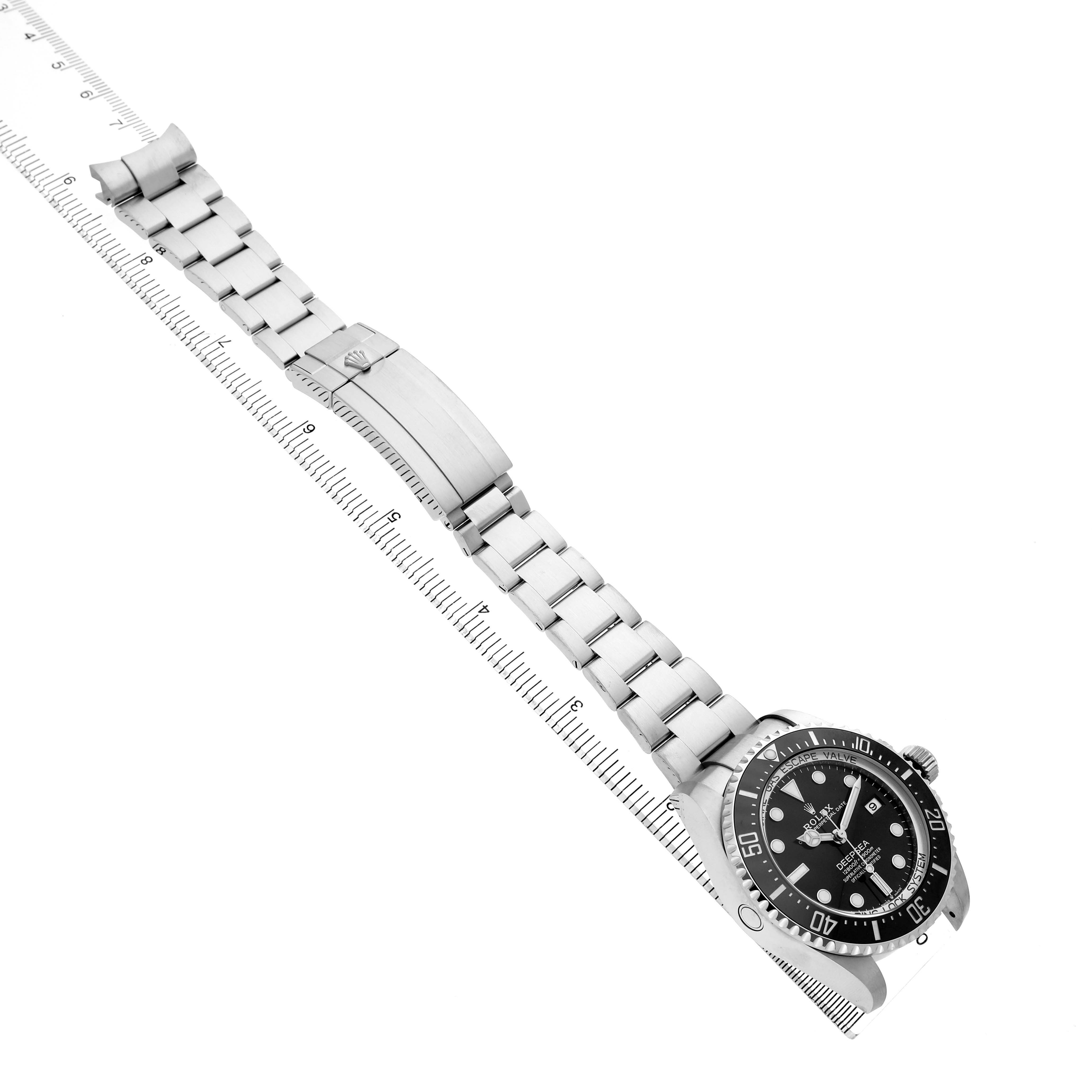 The Rolex Sea-Dweller 136660 Men's Stainless Steel Black Dial watch is shown from an angled top view, displaying the full bracelet, clasp, and face.