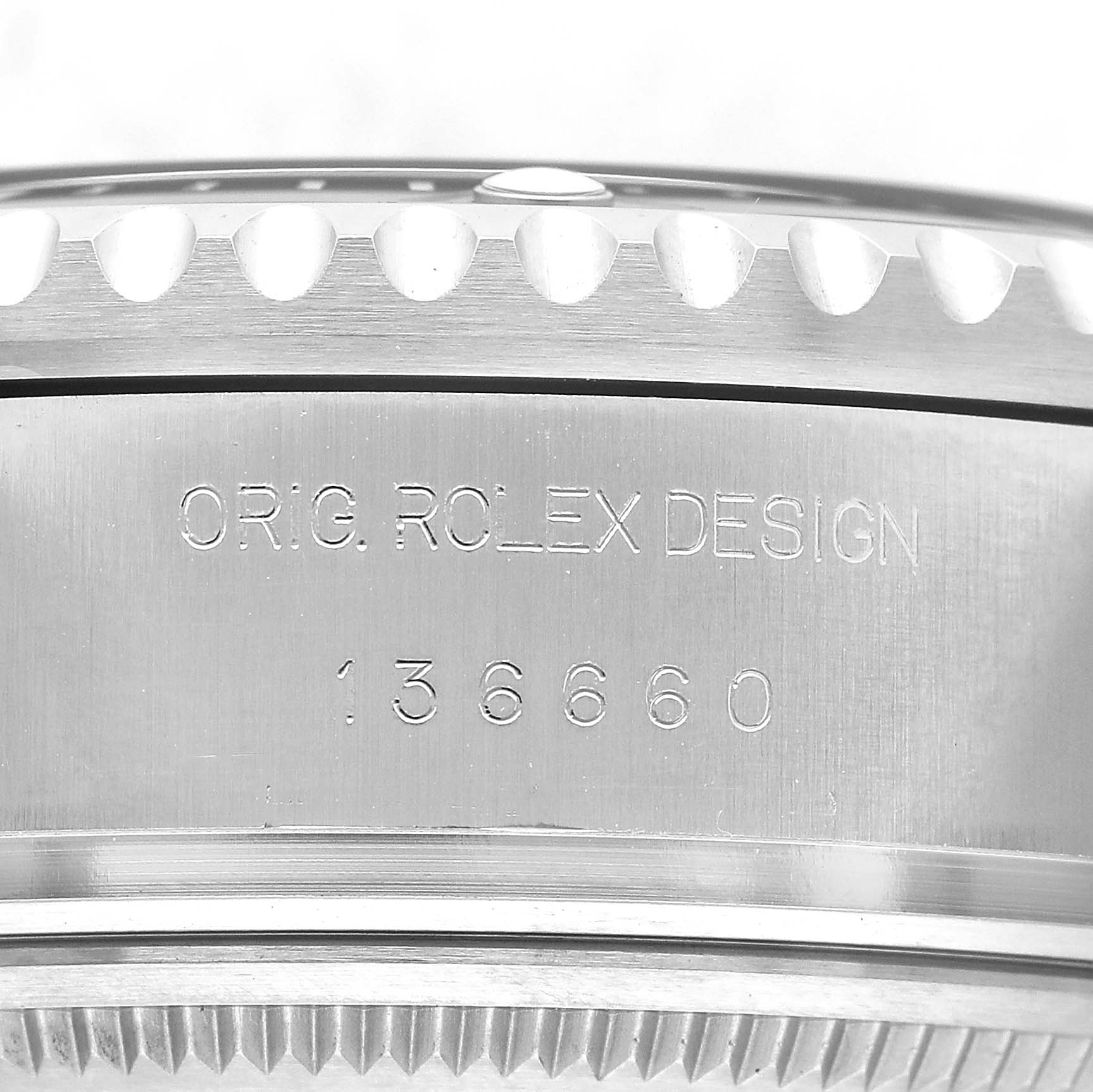 The image shows the side view of a Rolex Sea-Dweller 136660 Men's Stainless Steel Black Dial, highlighting the engraved case with "ORIG. ROLEX DESIGN" and a model number.