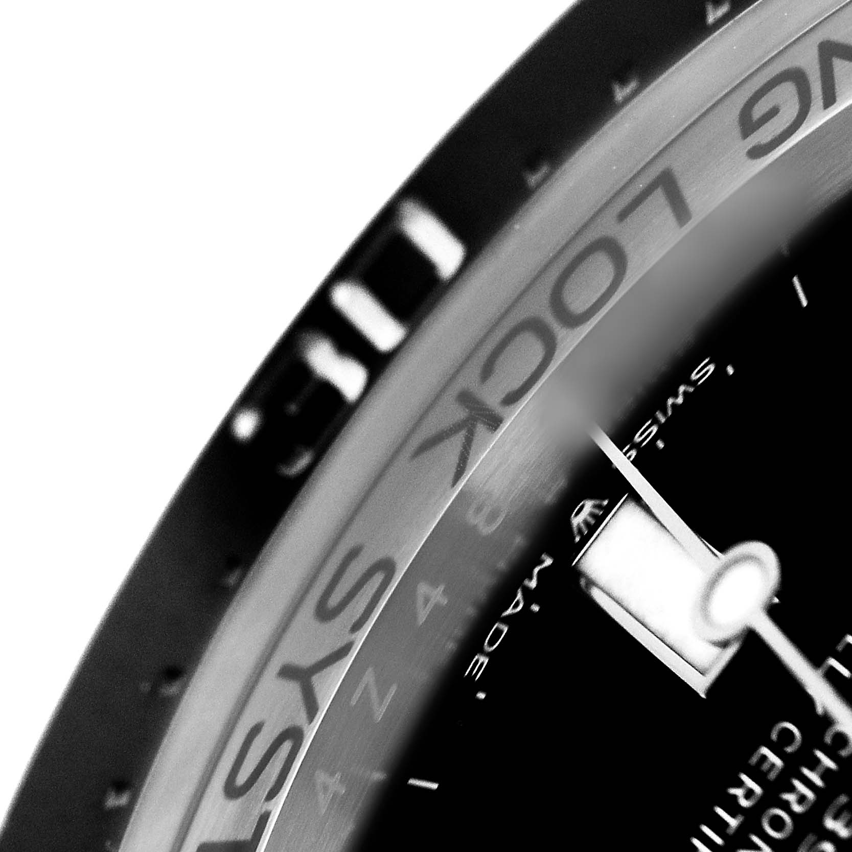 The image shows a close-up of the bezel and dial of a Rolex Sea-Dweller 136660 Men's Stainless Steel Black Dial watch, highlighting the markings and part of the hands.